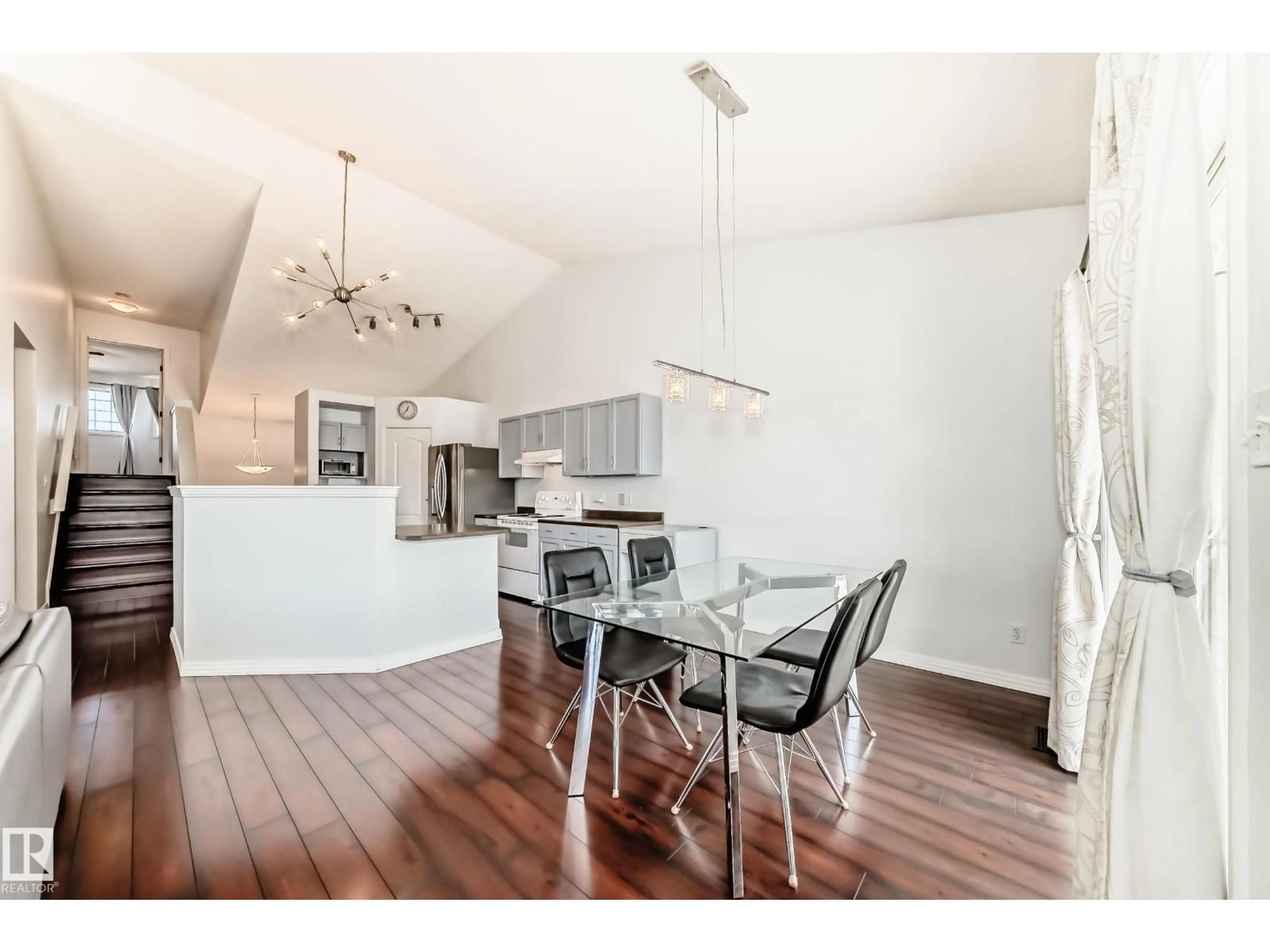Open concept kitchen, wood/laminate floor for 4823 147 AV, Edmonton Alberta T5Y2X2