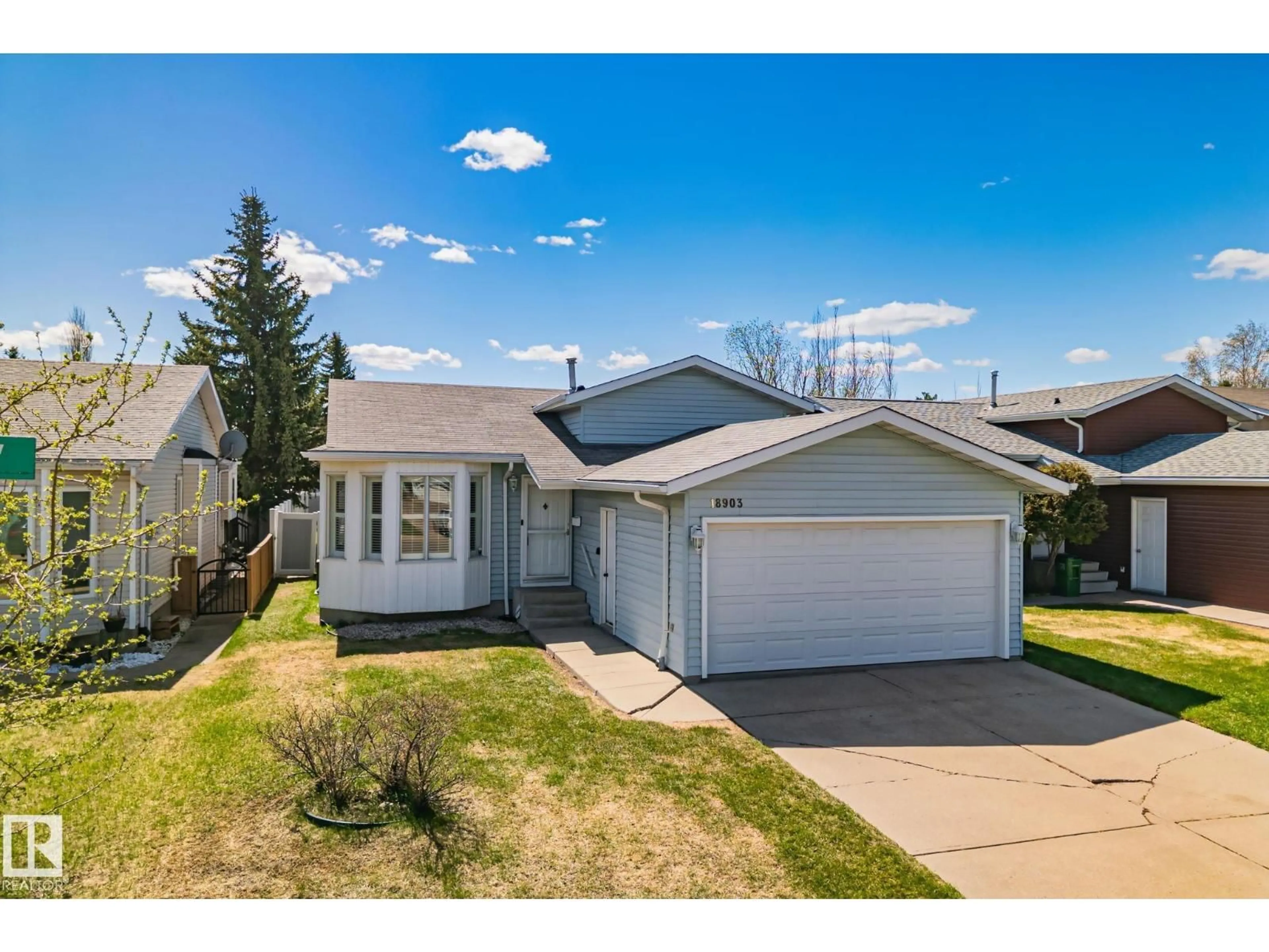 Home with vinyl exterior material, street for 18903 70 AV, Edmonton Alberta T5T5E1