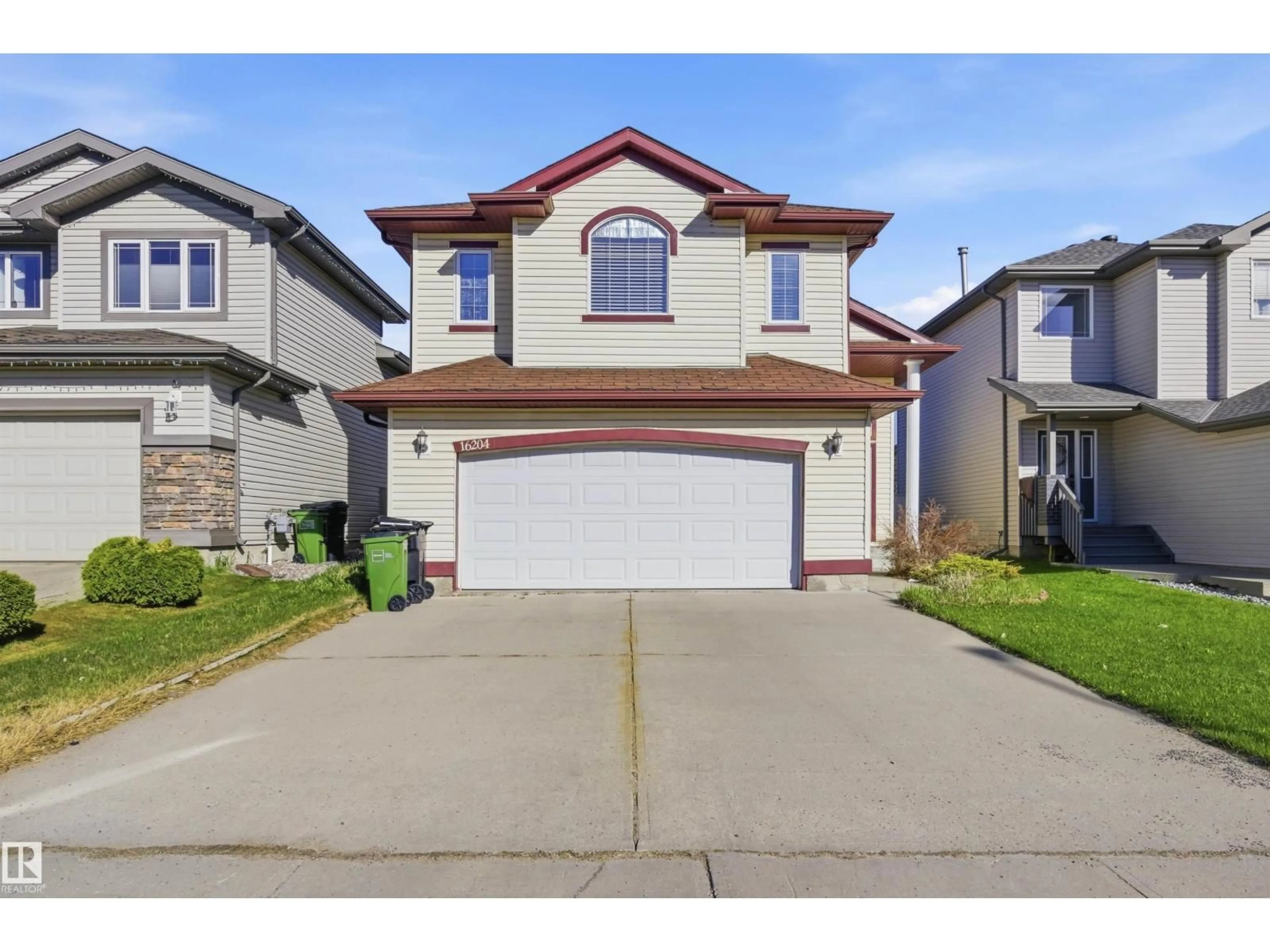 Home with vinyl exterior material, street for NW - 16204 48 ST, Edmonton Alberta T5A2J7