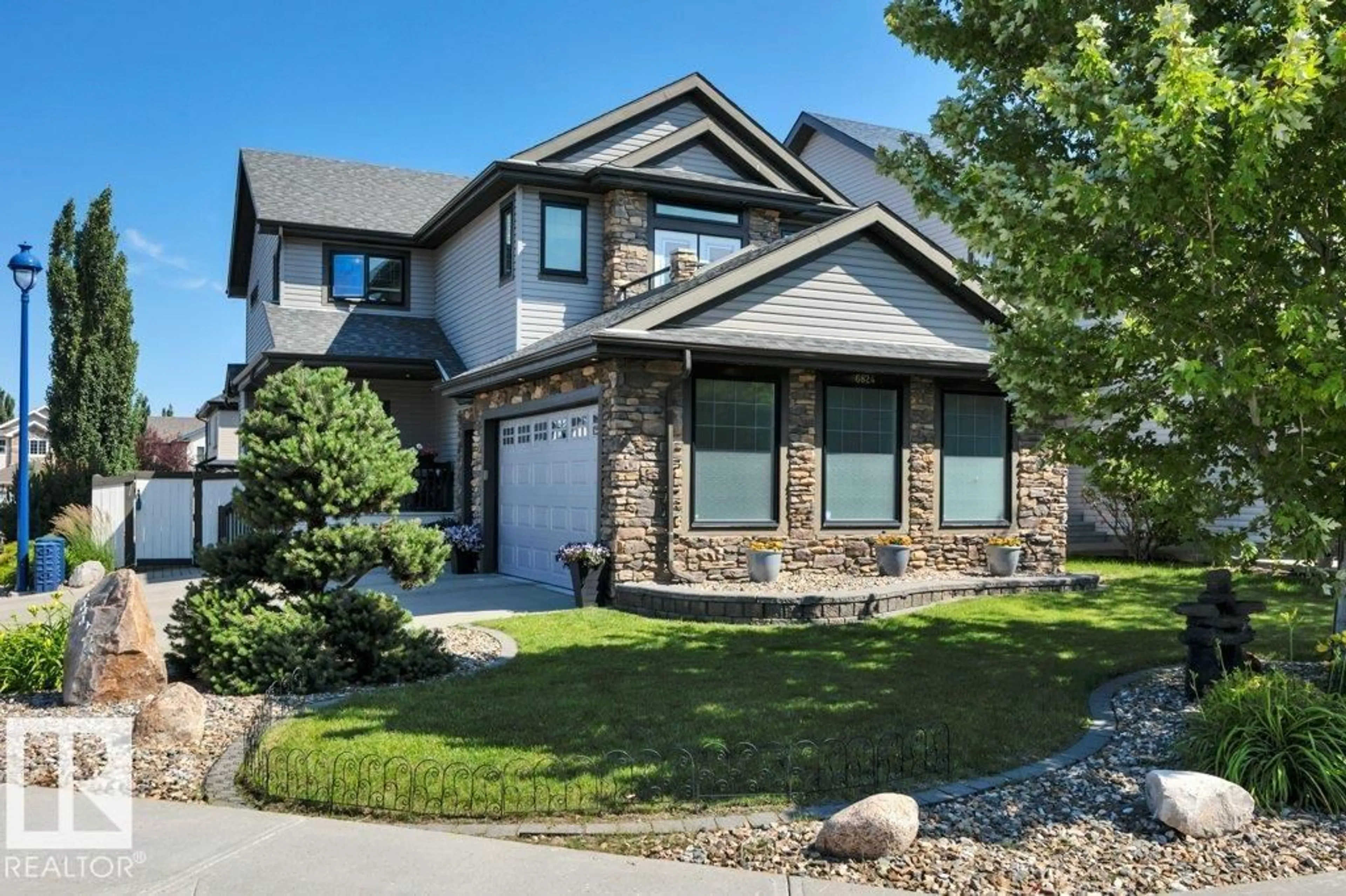 Home with vinyl exterior material, street for 6824 19A AV, Edmonton Alberta T6X0M1