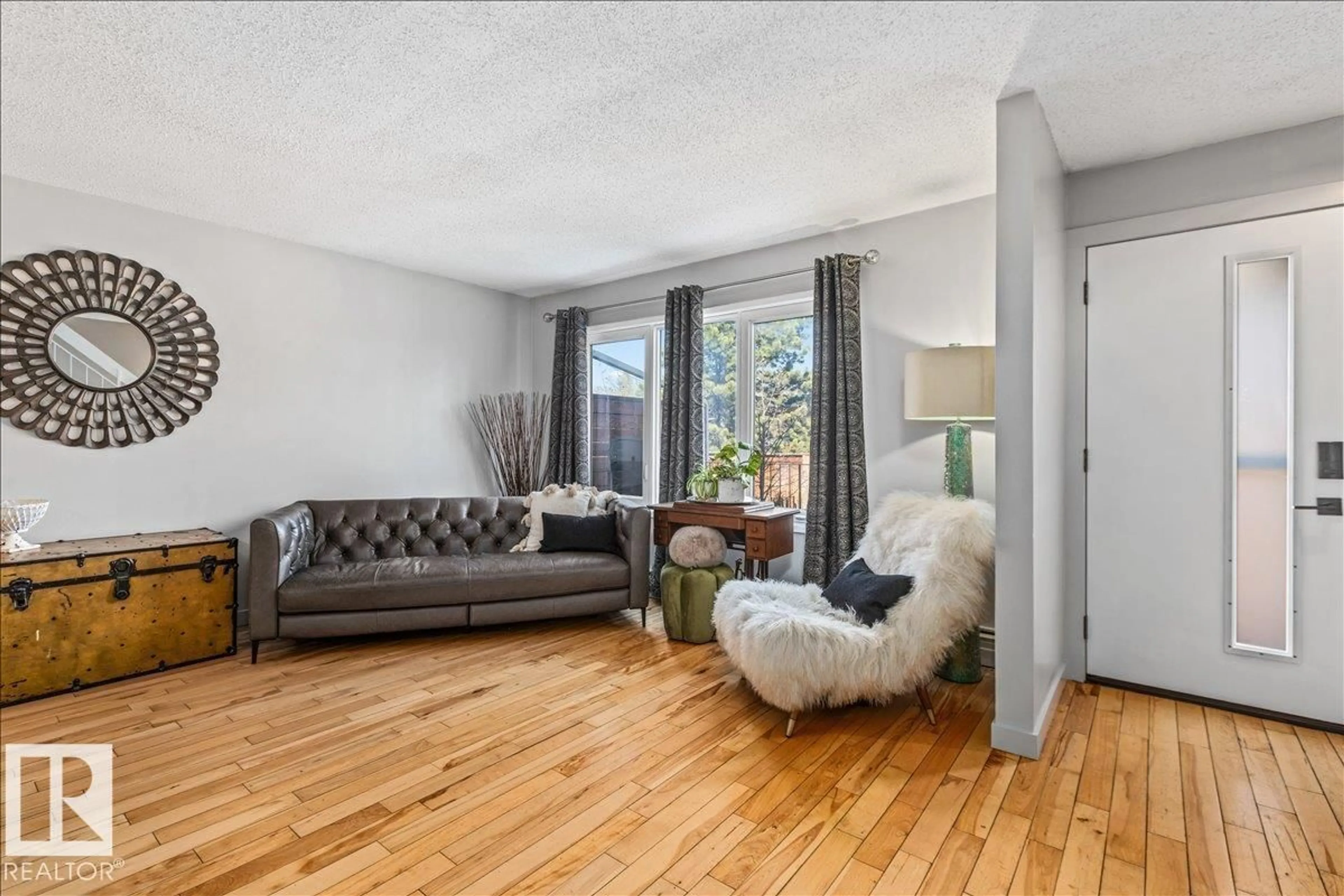Living room with furniture, unknown for 14222 91 AV, Edmonton Alberta T5R4Y4