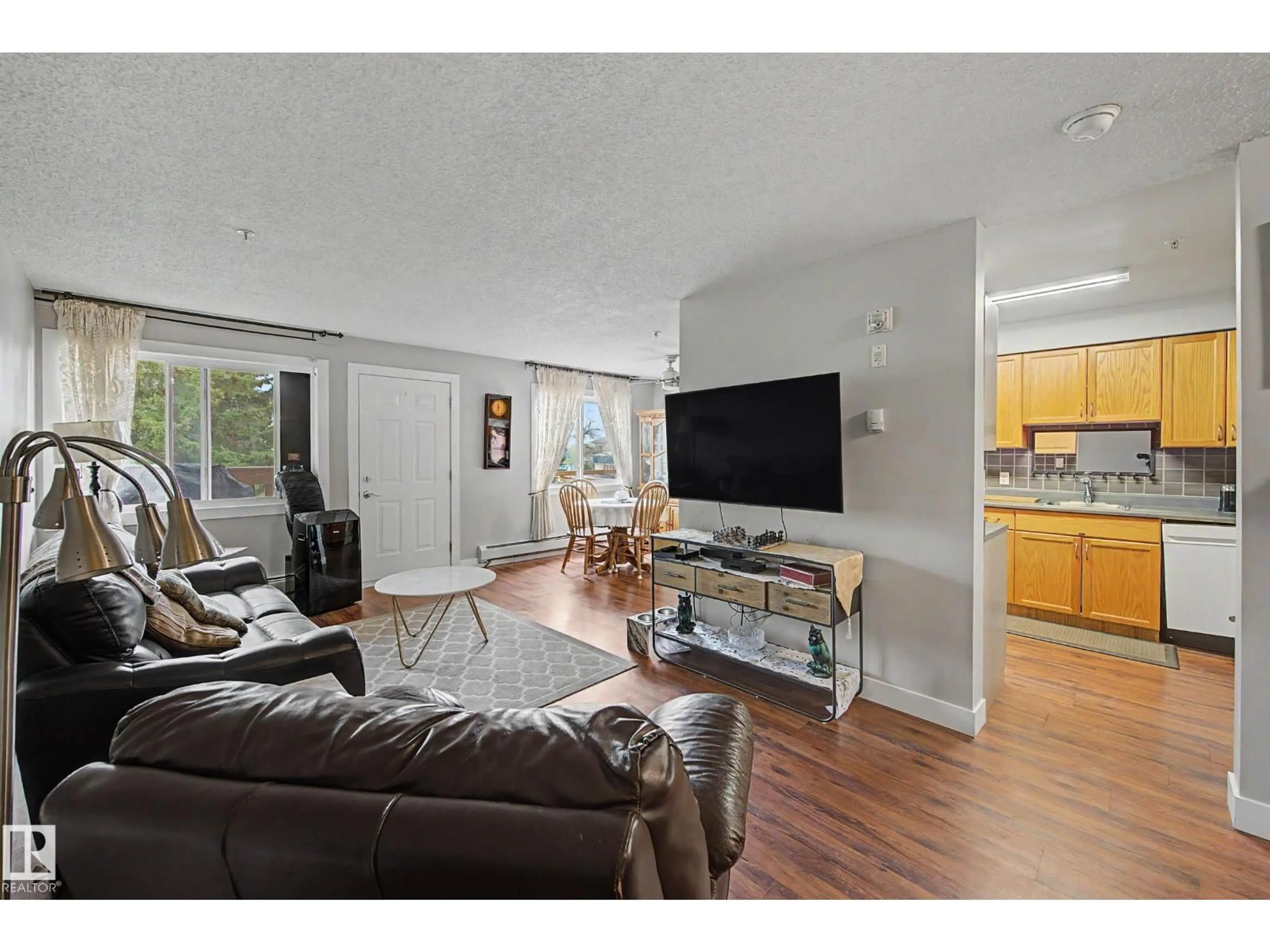 Living room with furniture, unknown for 103 - 105 MCKENNEY AV, St. Albert Alberta T8N2Y2