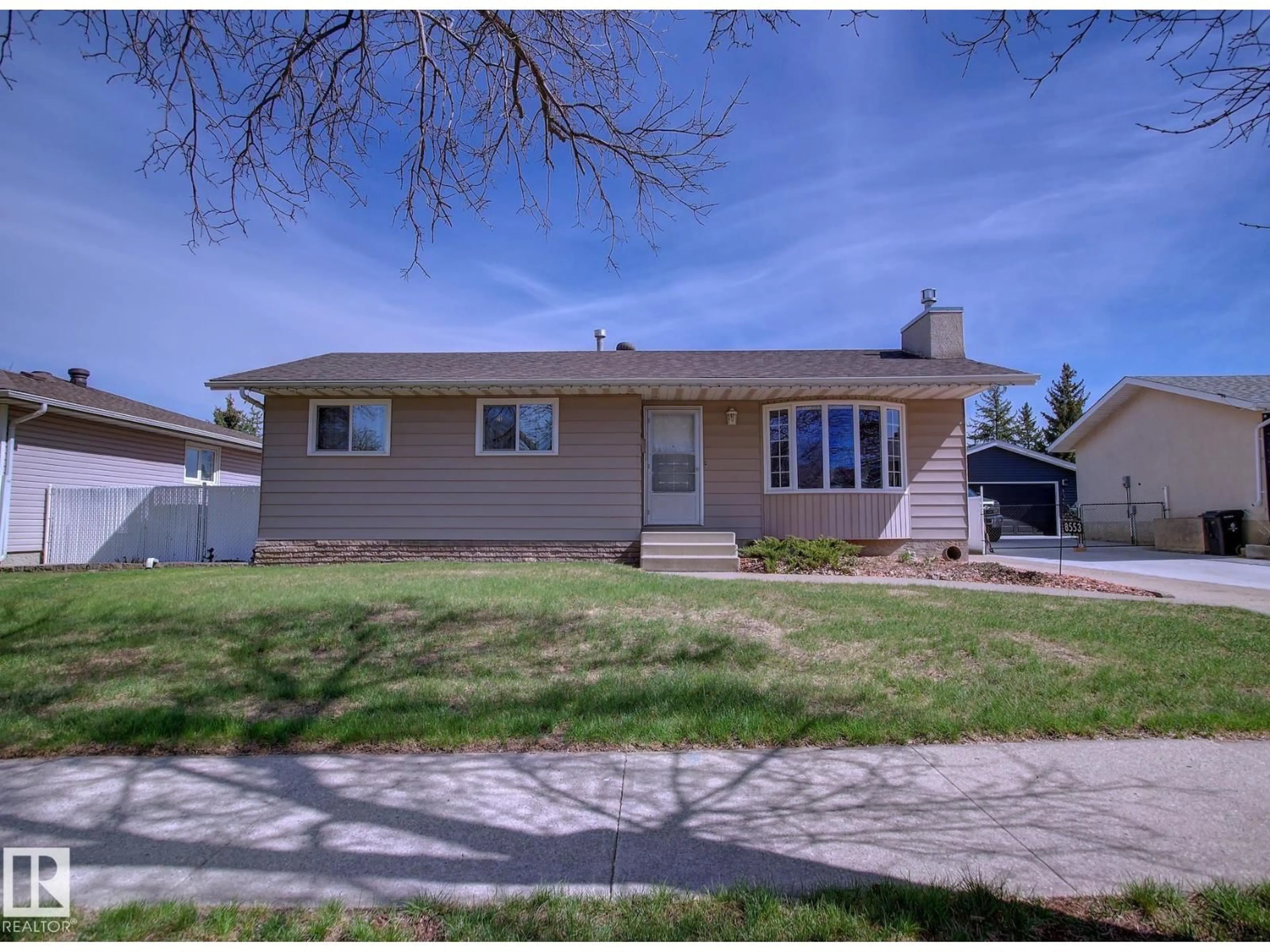 Home with vinyl exterior material, street for 8553 92 AV, Fort Saskatchewan Alberta T8L1A1