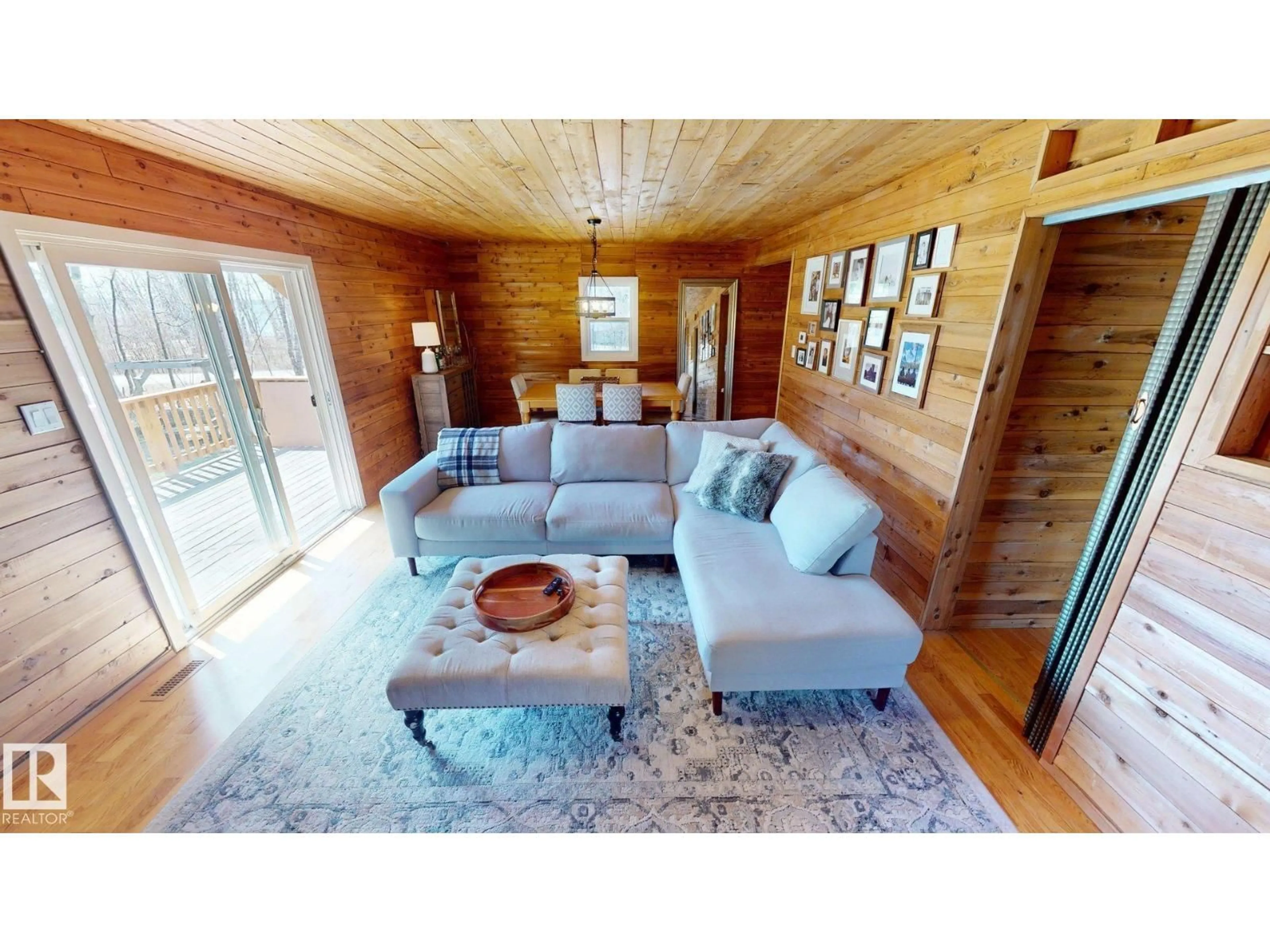 Living room with furniture, wood/laminate floor for 1010 47402 RGE RD 13, Rural Leduc County Alberta T0C2P0