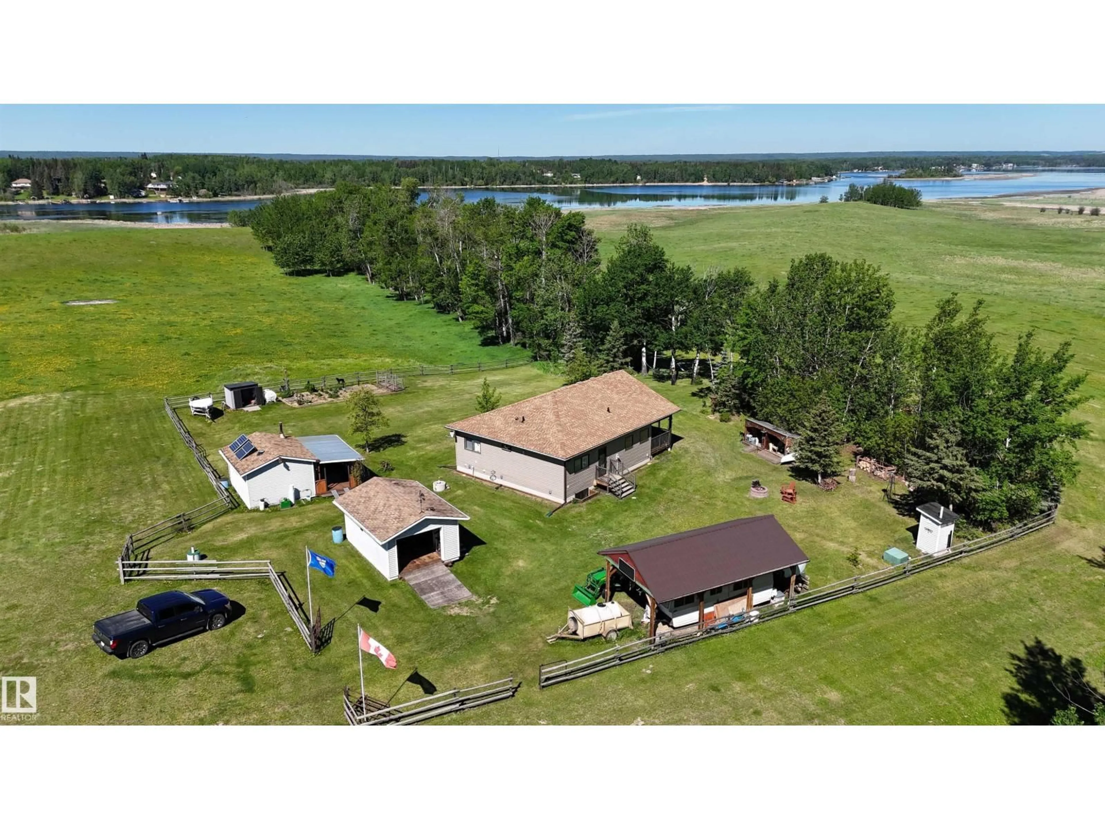 A pic from outside/outdoor area/front of a property/back of a property/a pic from drone, water/lake/river/ocean view for 240002 TWP RD 674, Rural Athabasca County Alberta T0S0A1