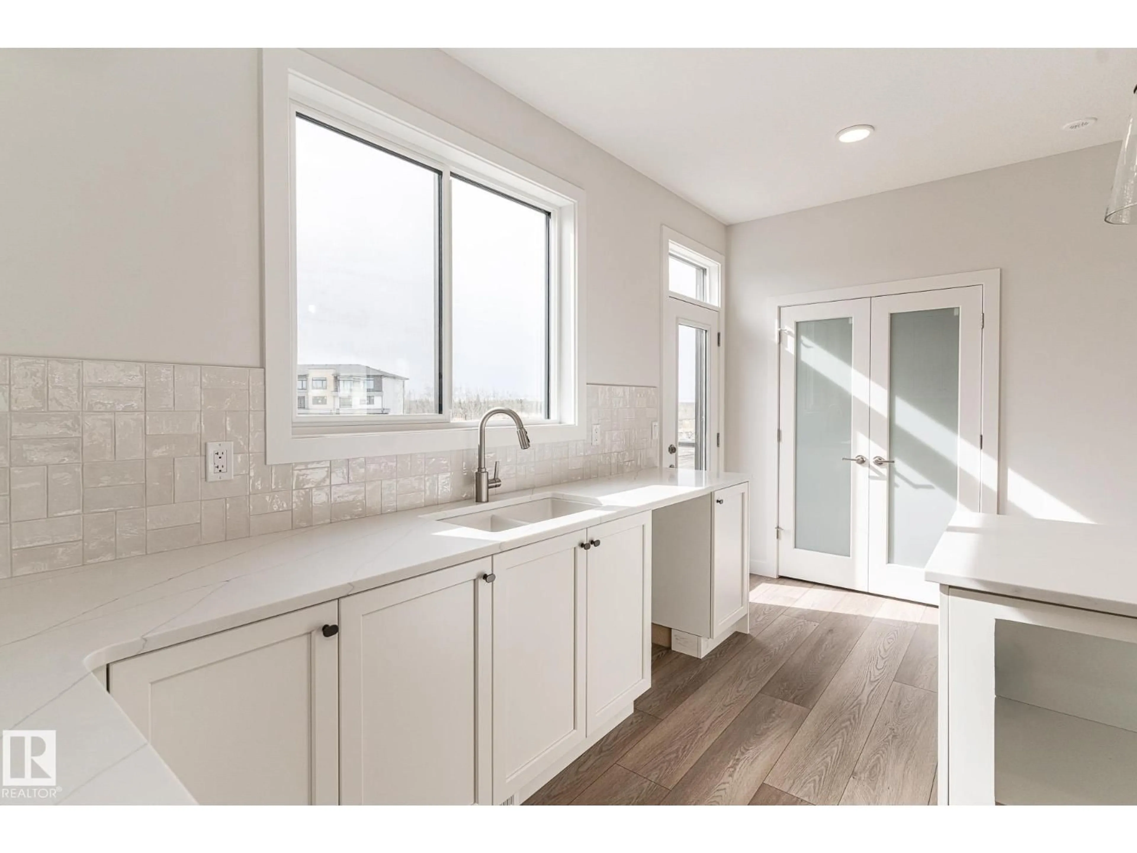 Open concept kitchen, ceramic/tile floor for 7135 MAY CR, Edmonton Alberta T6R0V9