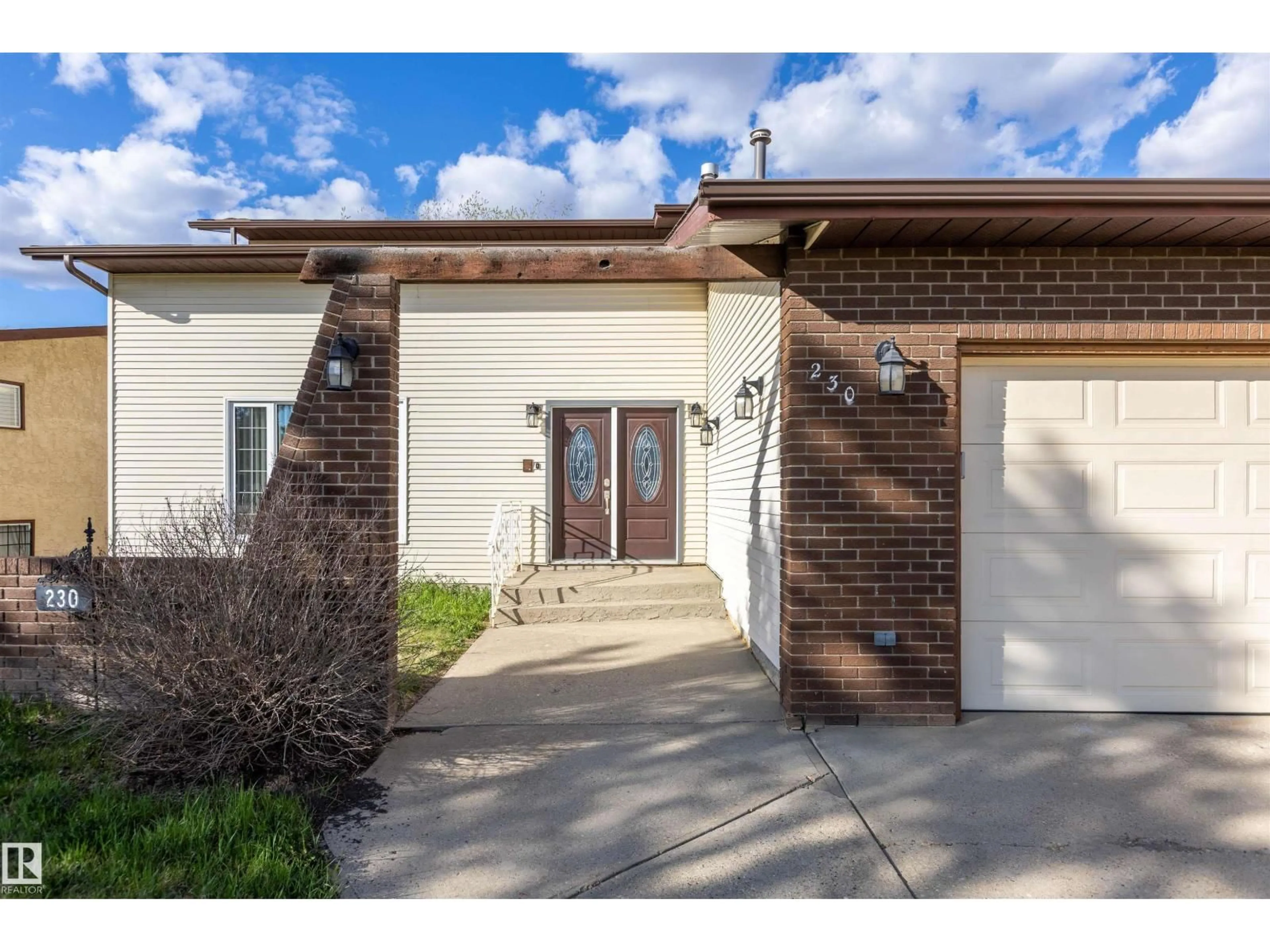 Home with brick exterior material, street for 230 GRANDIN DR, Morinville Alberta T8R1H7