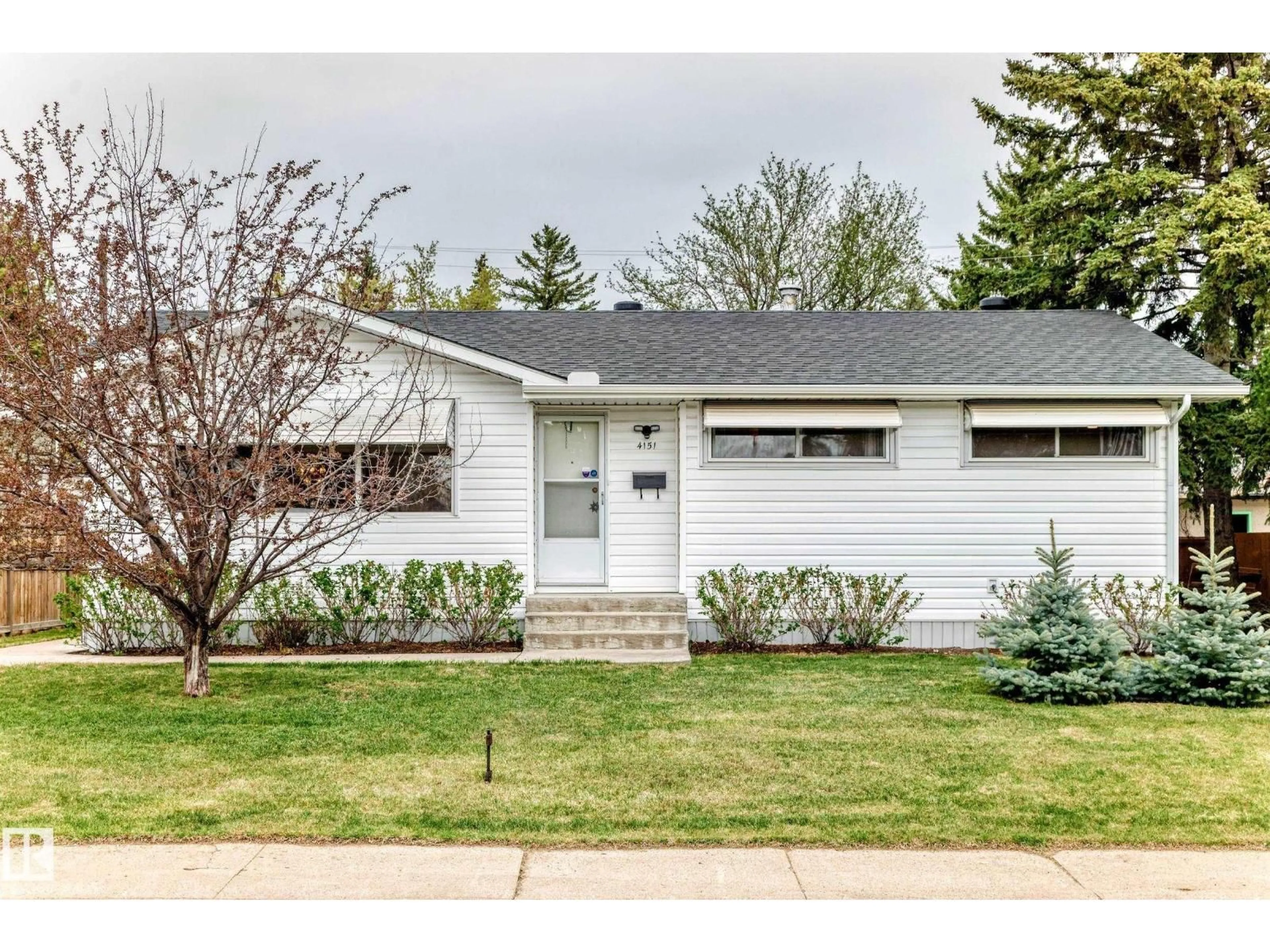 Home with vinyl exterior material, street for NW - 4151 122 ST, Edmonton Alberta T6J1Z1
