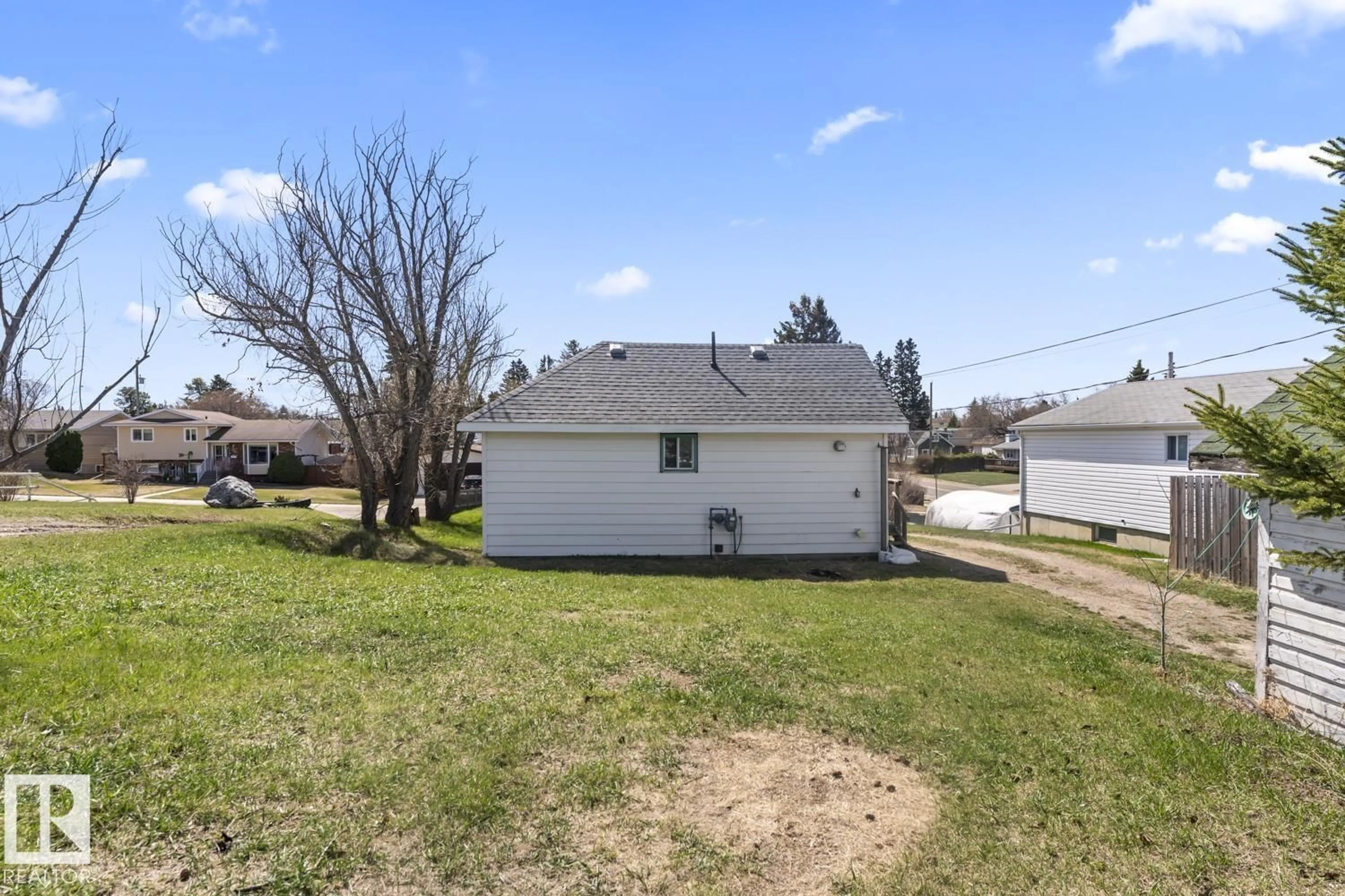 A pic from outside/outdoor area/front of a property/back of a property/a pic from drone, water/lake/river/ocean view for 818 11 AV, Cold Lake Alberta T9M1J1
