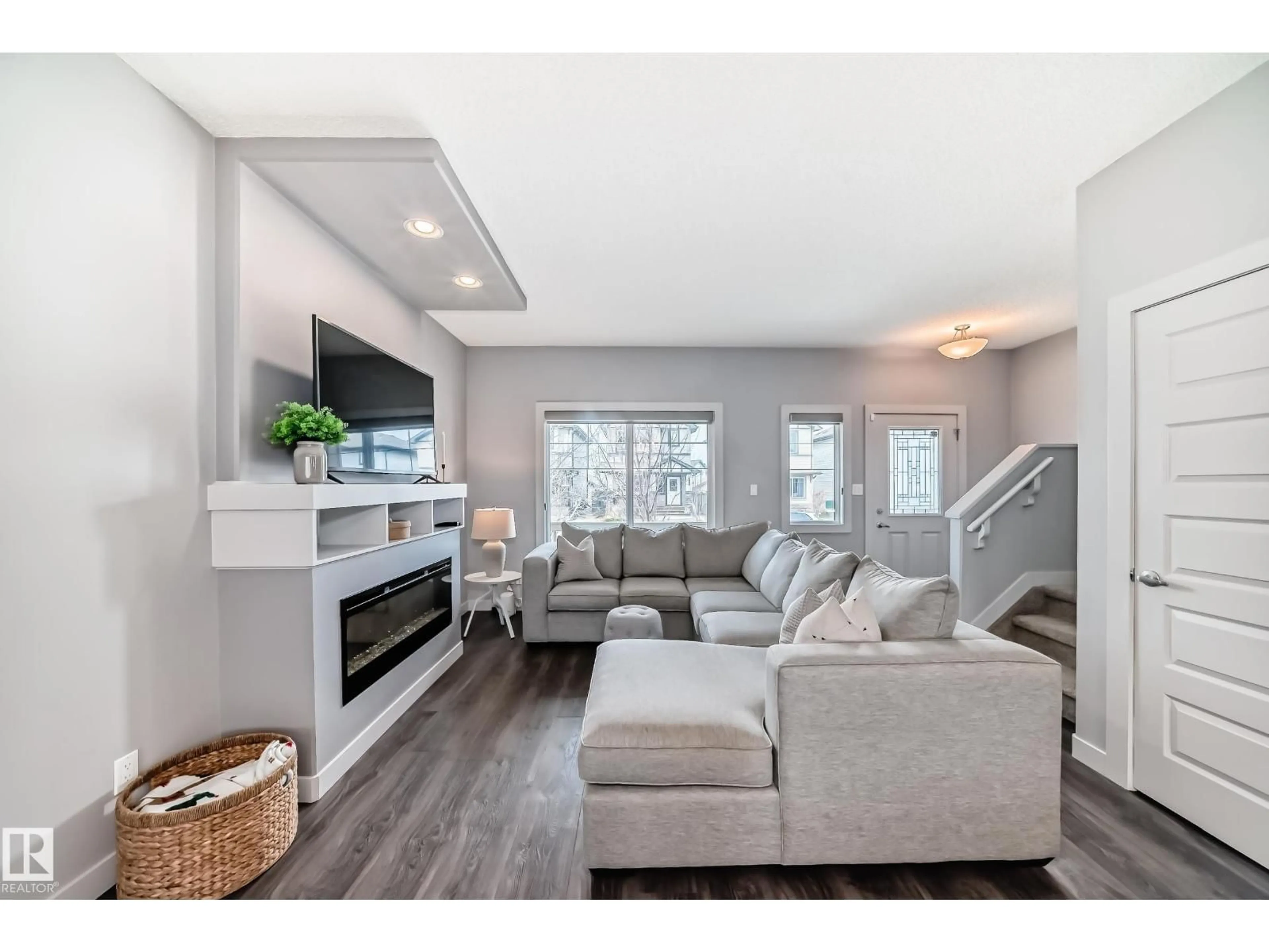 Living room with furniture, wood/laminate floor for SW - 6919 CARDINAL WD, Edmonton Alberta T6W2Y3