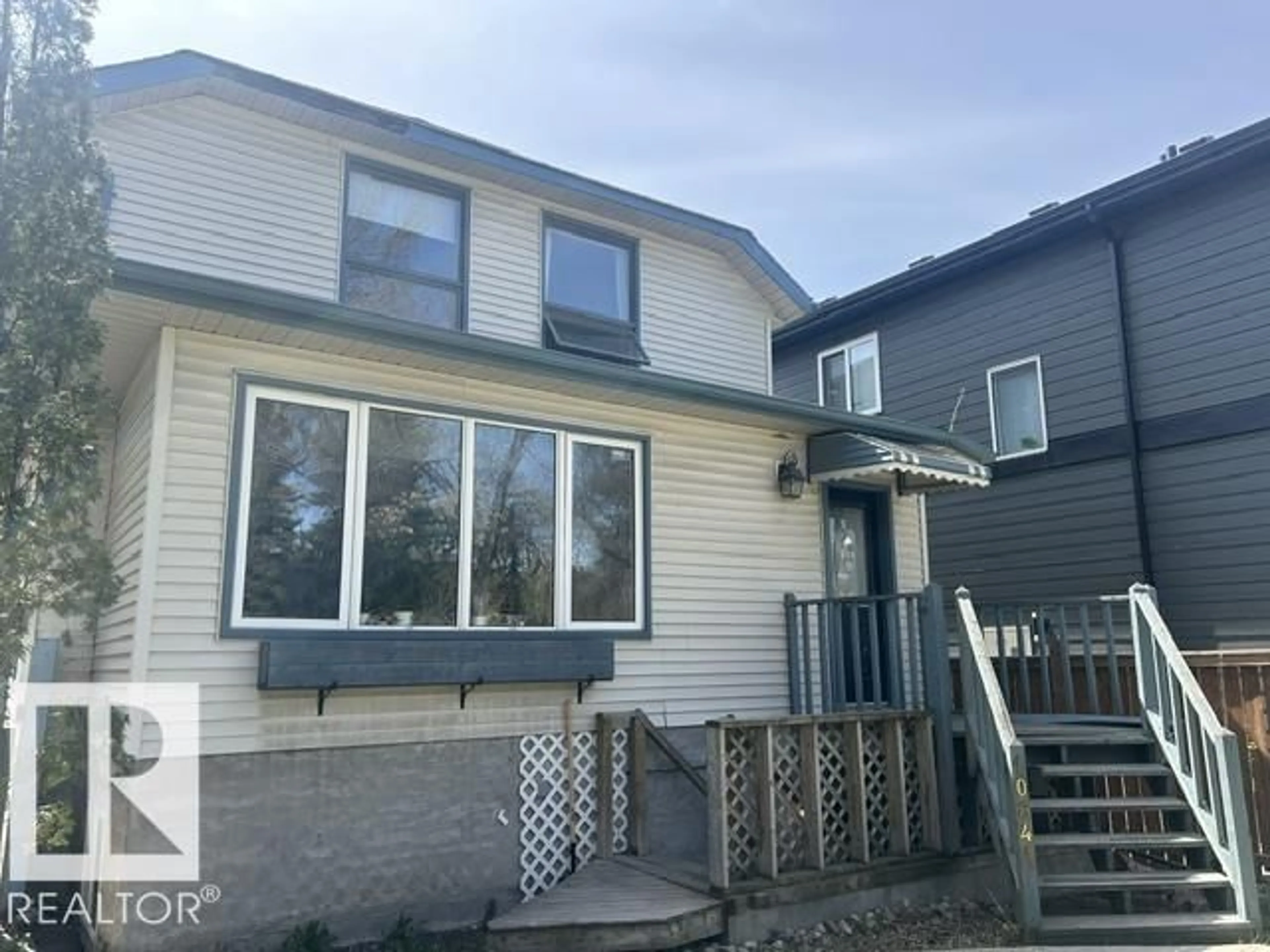 Home with vinyl exterior material, street for 10841 80 AV, Edmonton Alberta T6E1V9