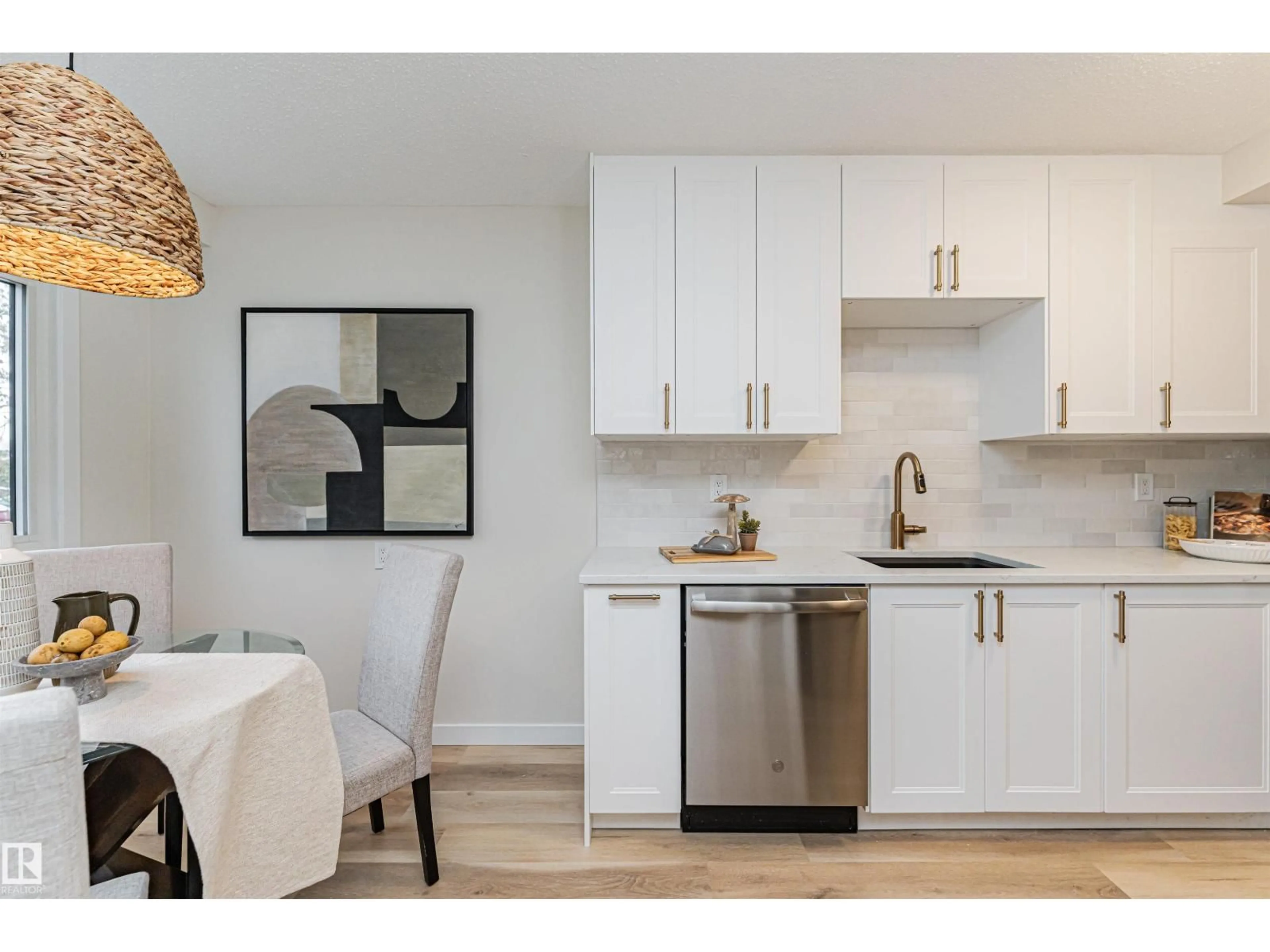 Open concept kitchen, wood/laminate floor for 3105 109 ST, Edmonton Alberta T6J4N6
