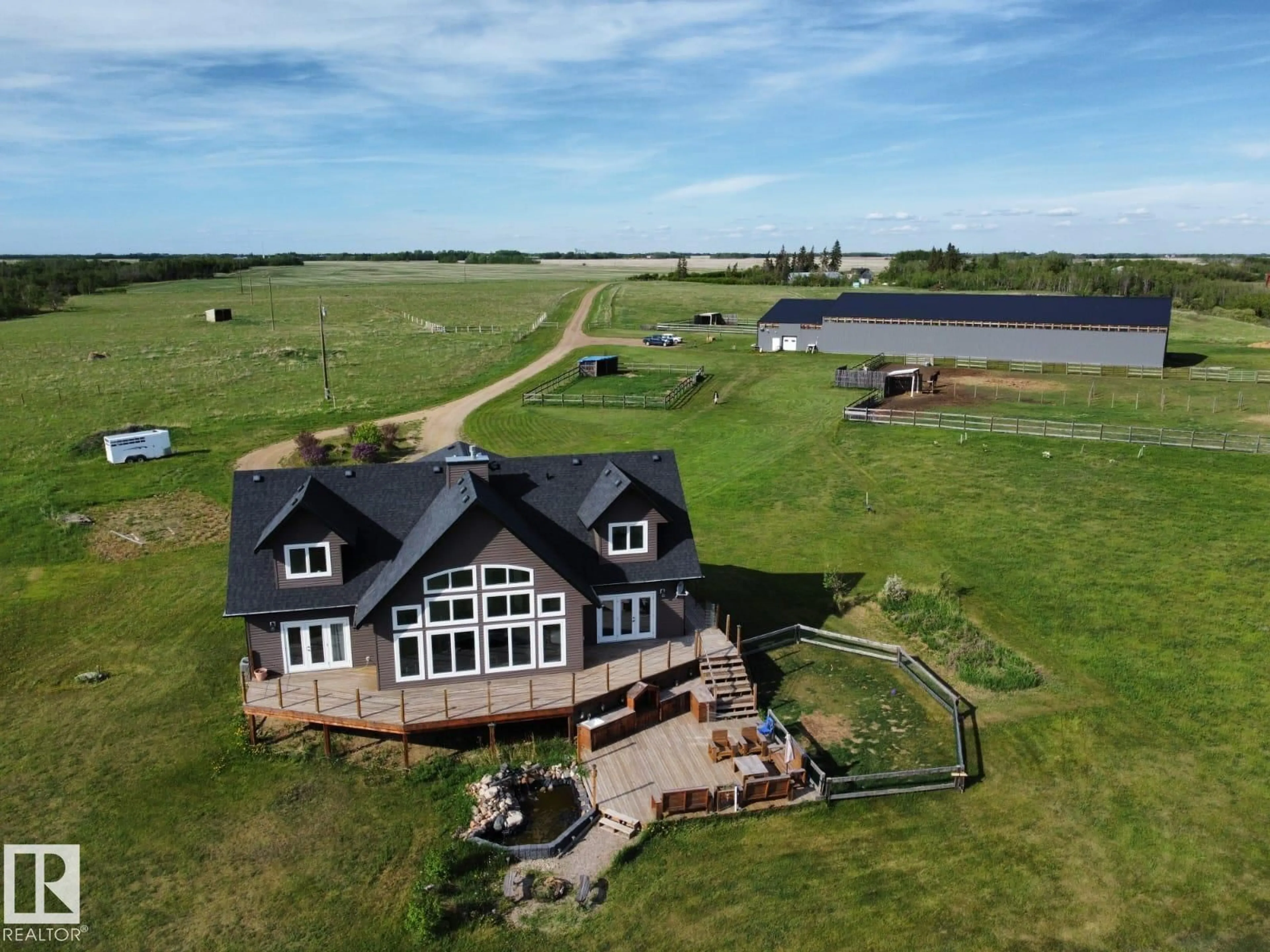 A pic from outside/outdoor area/front of a property/back of a property/a pic from drone, water/lake/river/ocean view for 20213 TOWNSHIP ROAD 460, Rural Camrose County Alberta T4V2M9