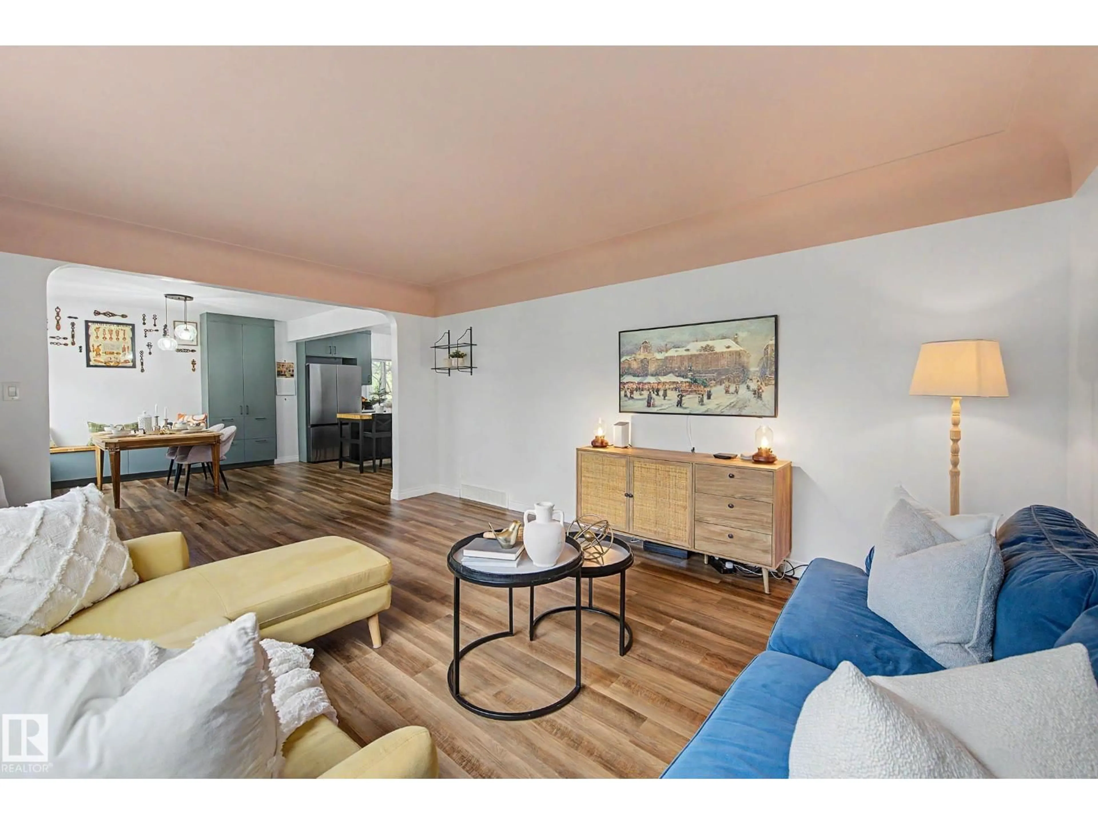 Living room with furniture, wood/laminate floor for 13316 109A AV AV, Edmonton Alberta T5M2J6