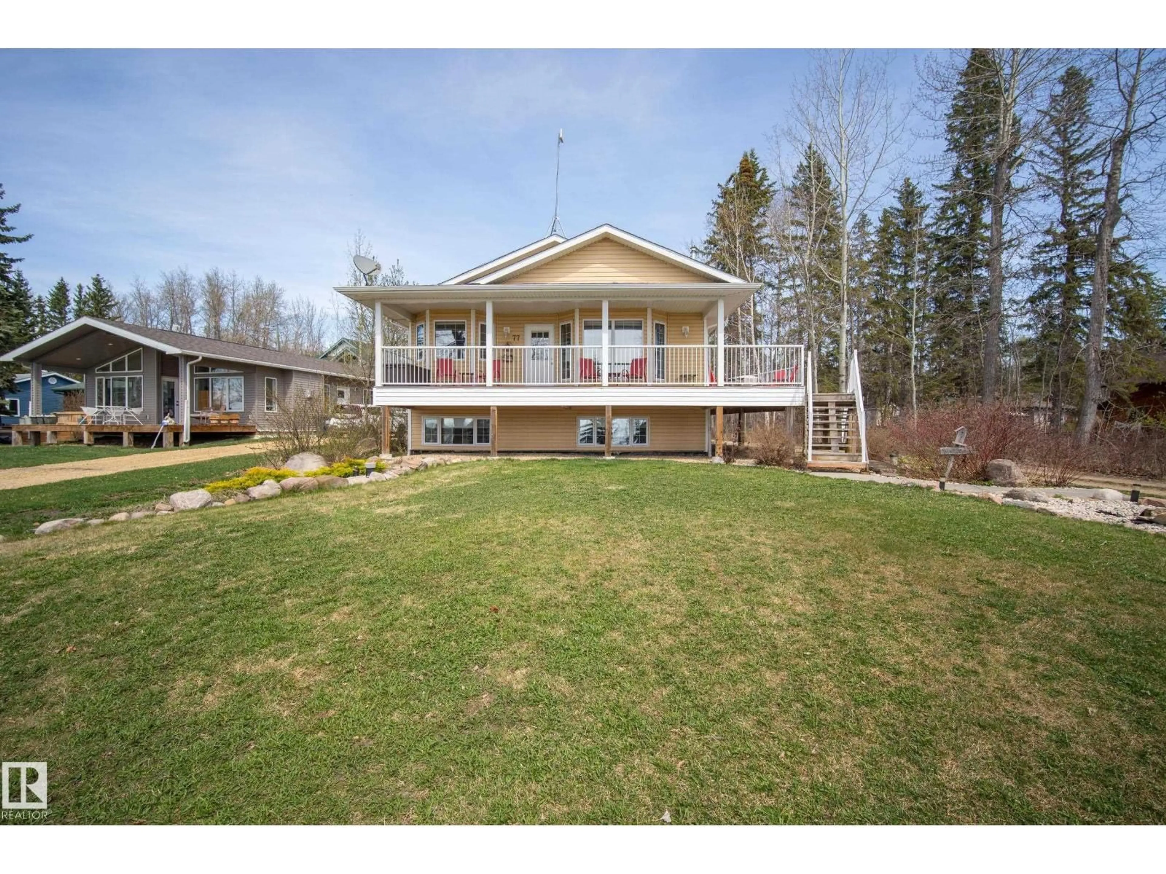 A pic from outside/outdoor area/front of a property/back of a property/a pic from drone, water/lake/river/ocean view for 77 LAKESHORE DR, Rural Leduc County Alberta T0C2P0
