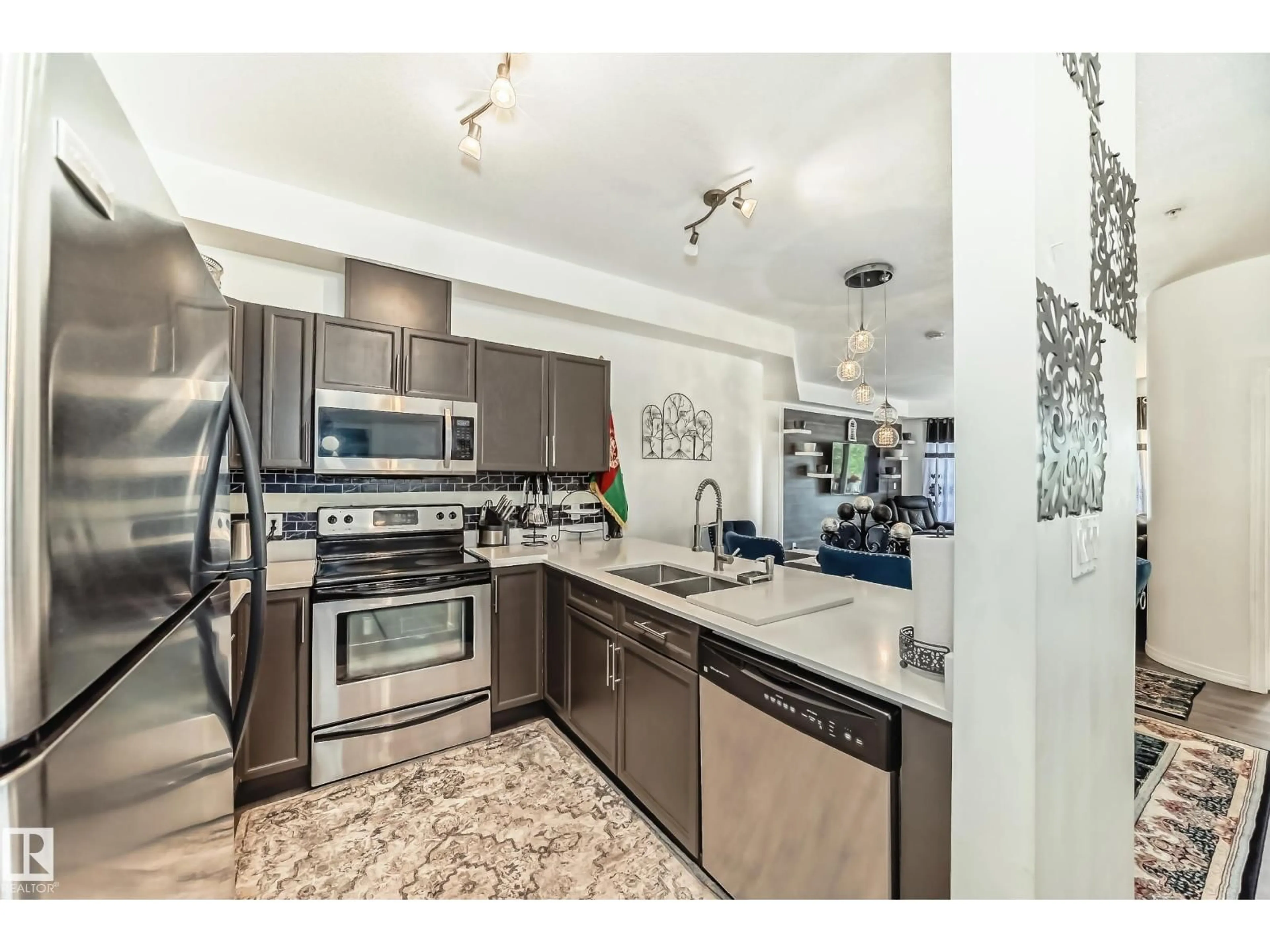 Open concept kitchen, ceramic/tile floor for 207 - 4316 139 AV, Edmonton Alberta T5Y0L1