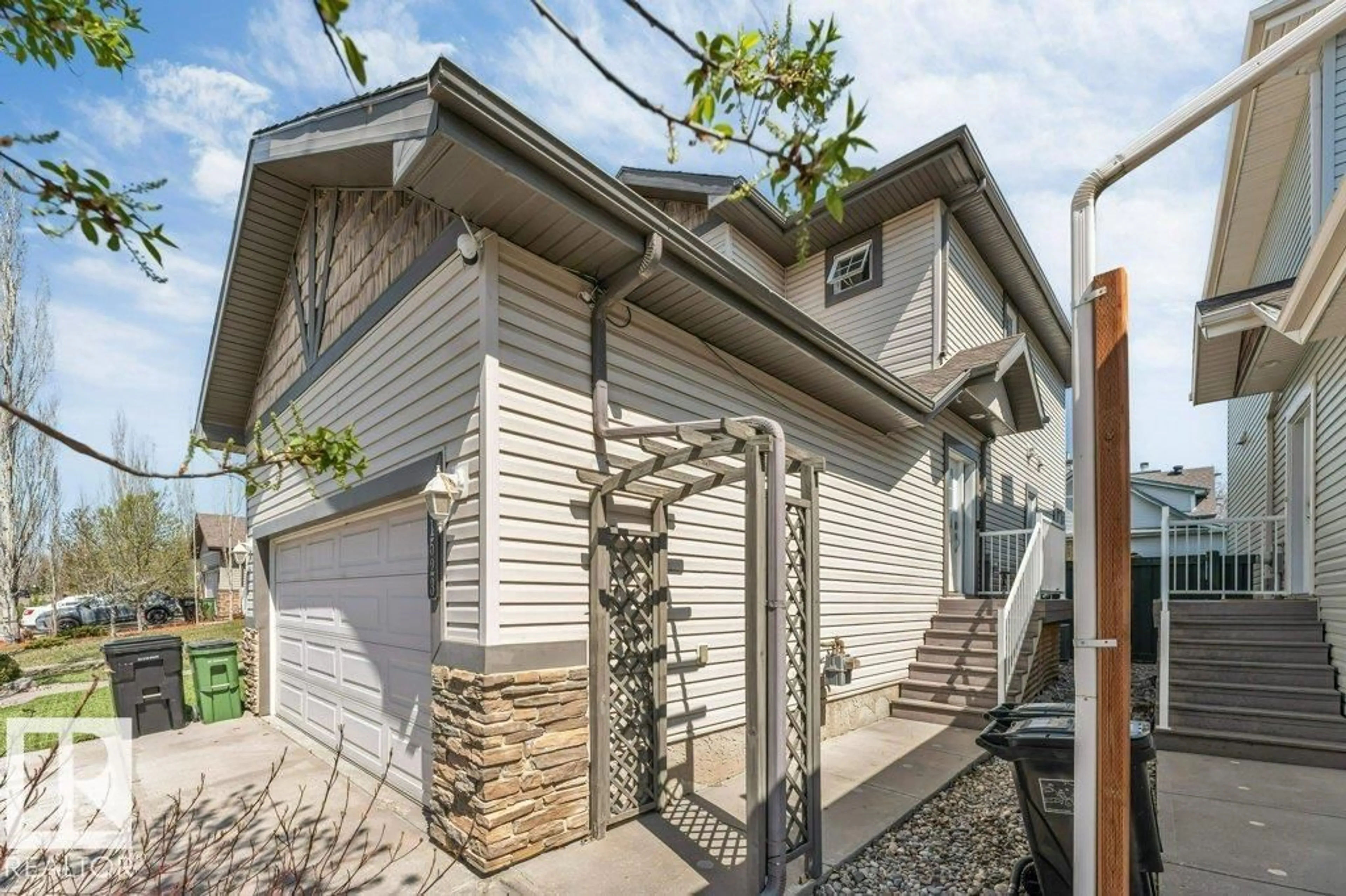 Home with vinyl exterior material, street for 1523 RUTHERFORD RD, Edmonton Alberta T6W1Y1
