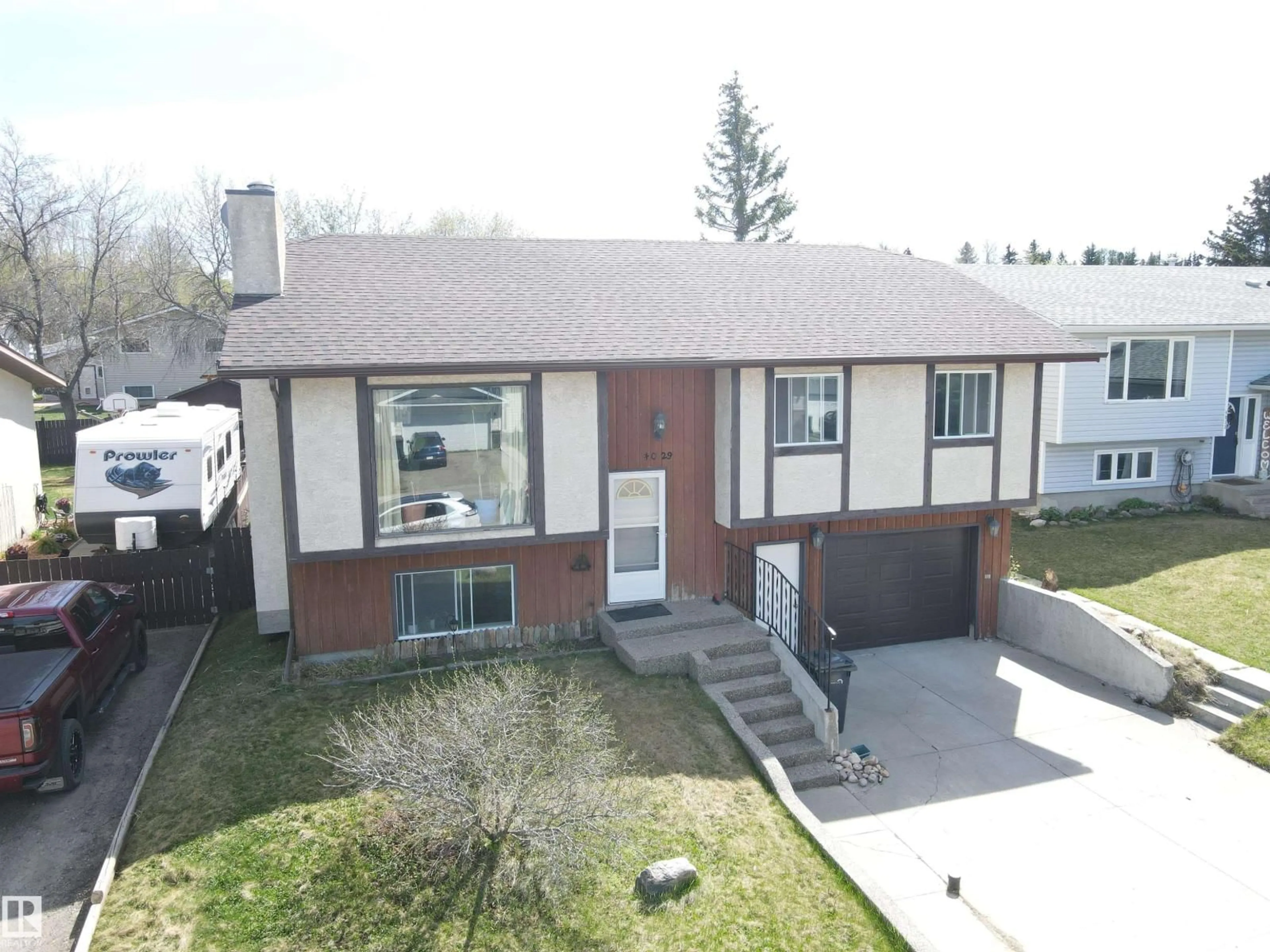 A pic from outside/outdoor area/front of a property/back of a property/a pic from drone, street for 4029 55 AV, Drayton Valley Alberta T7A1B2