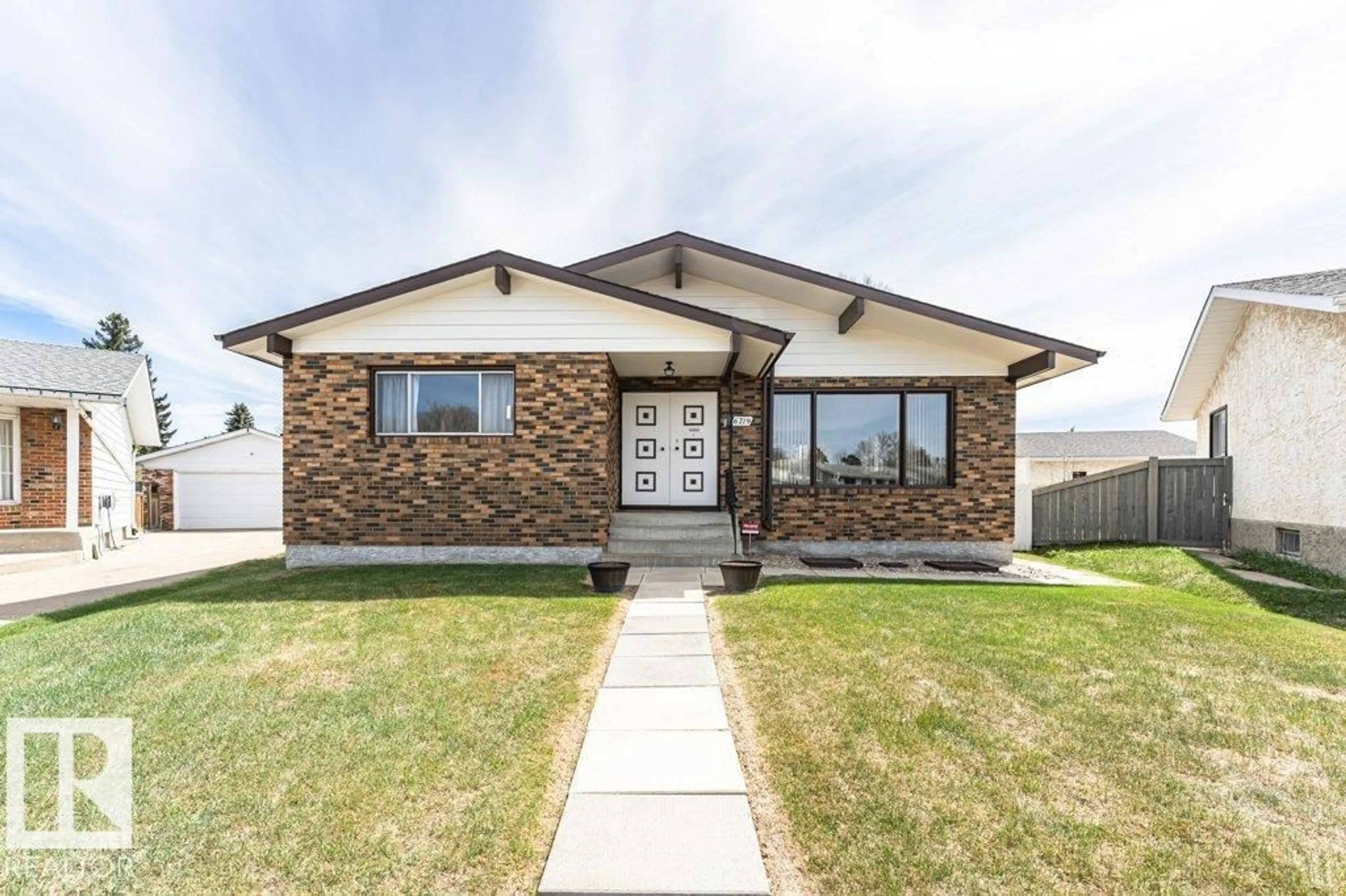 Home with brick exterior material, street for 6719 31A AV, Edmonton Alberta T6K1M4
