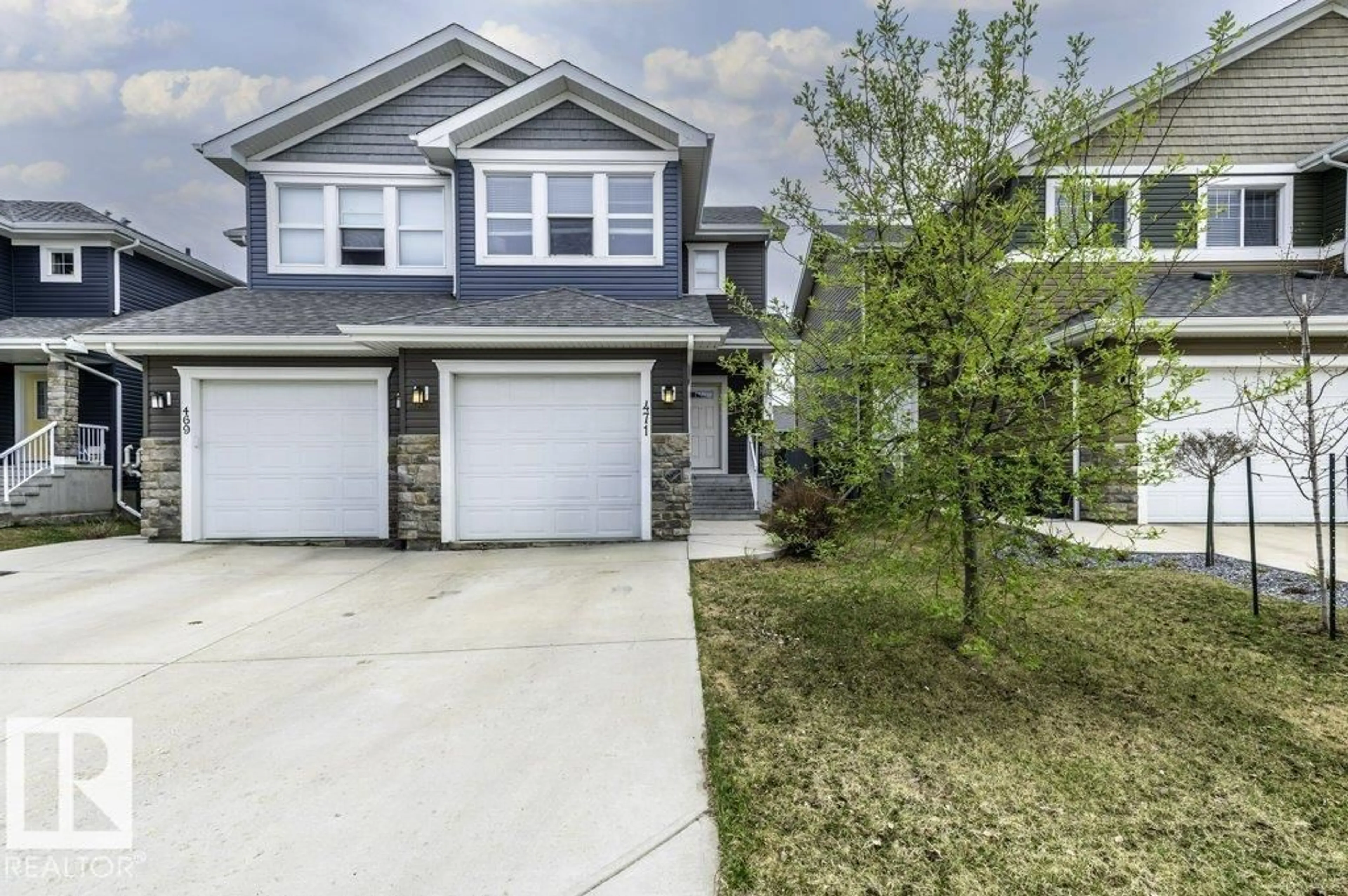Home with vinyl exterior material, street for 471 REED CR, Leduc Alberta T9E0R5