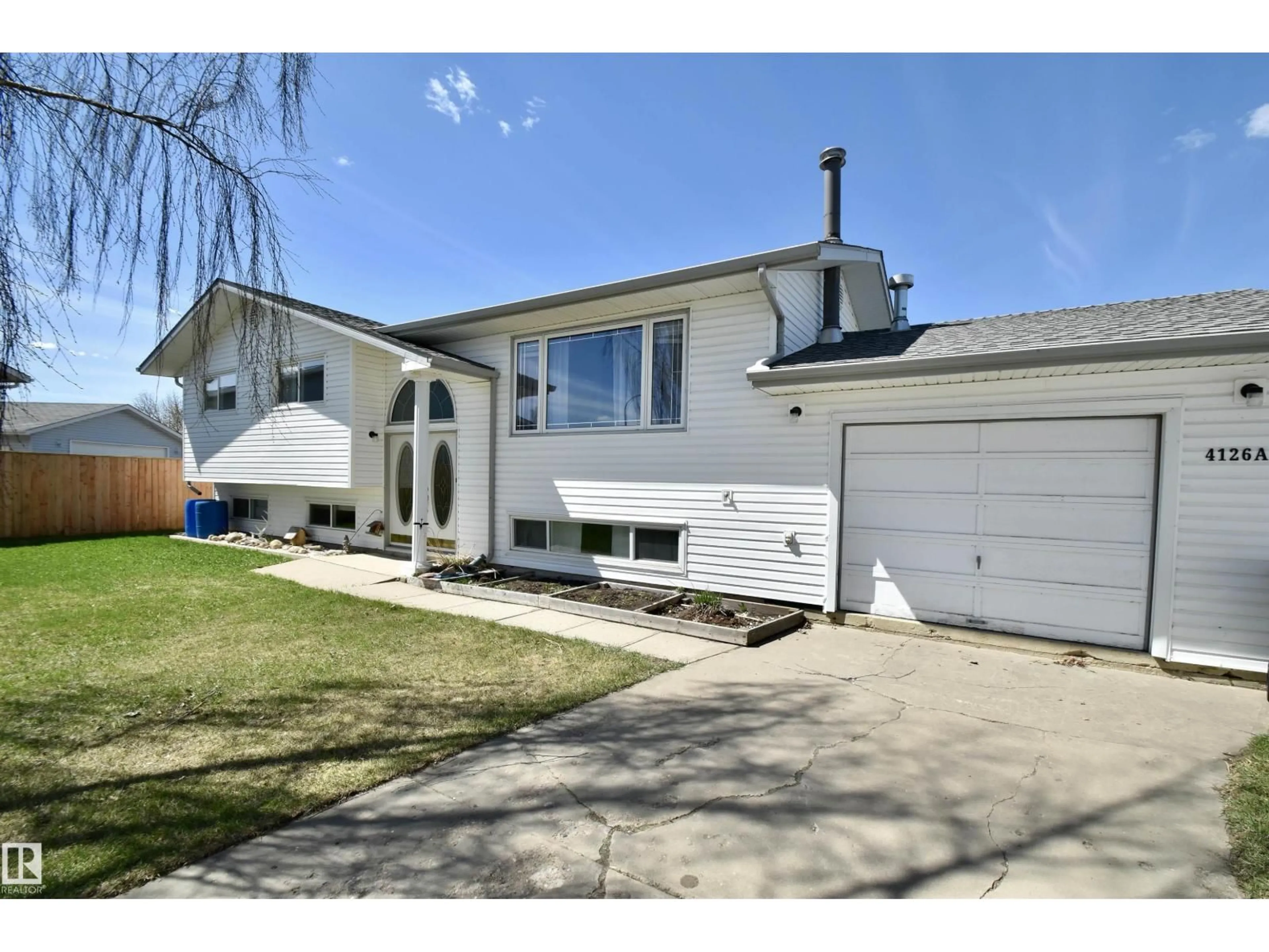 Home with vinyl exterior material, street for 4126A 47 AV, St. Paul Town Alberta T0A3A2
