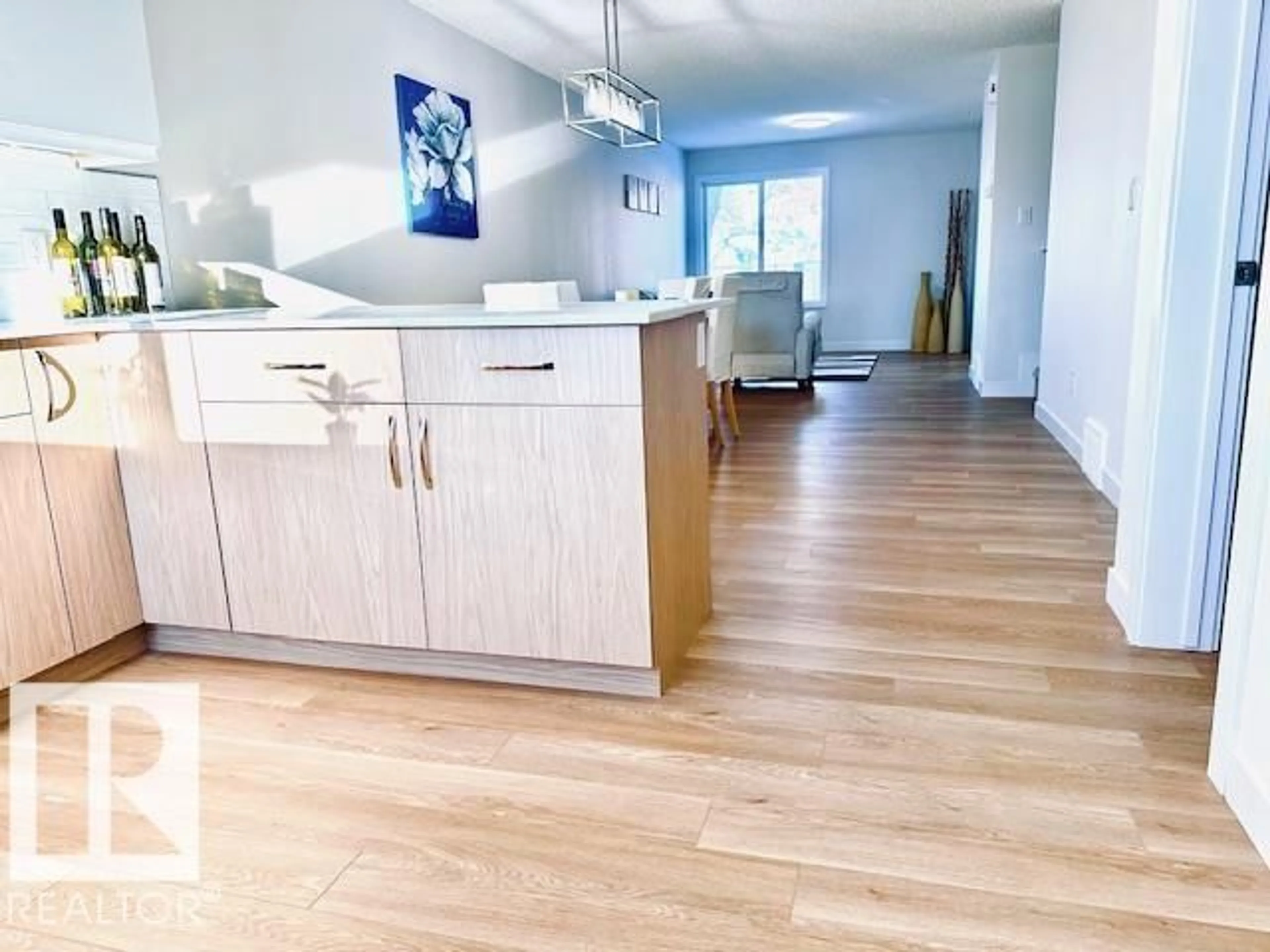 Open concept kitchen, wood/laminate floor for 4845 115 AV, Edmonton Alberta T5W0W3