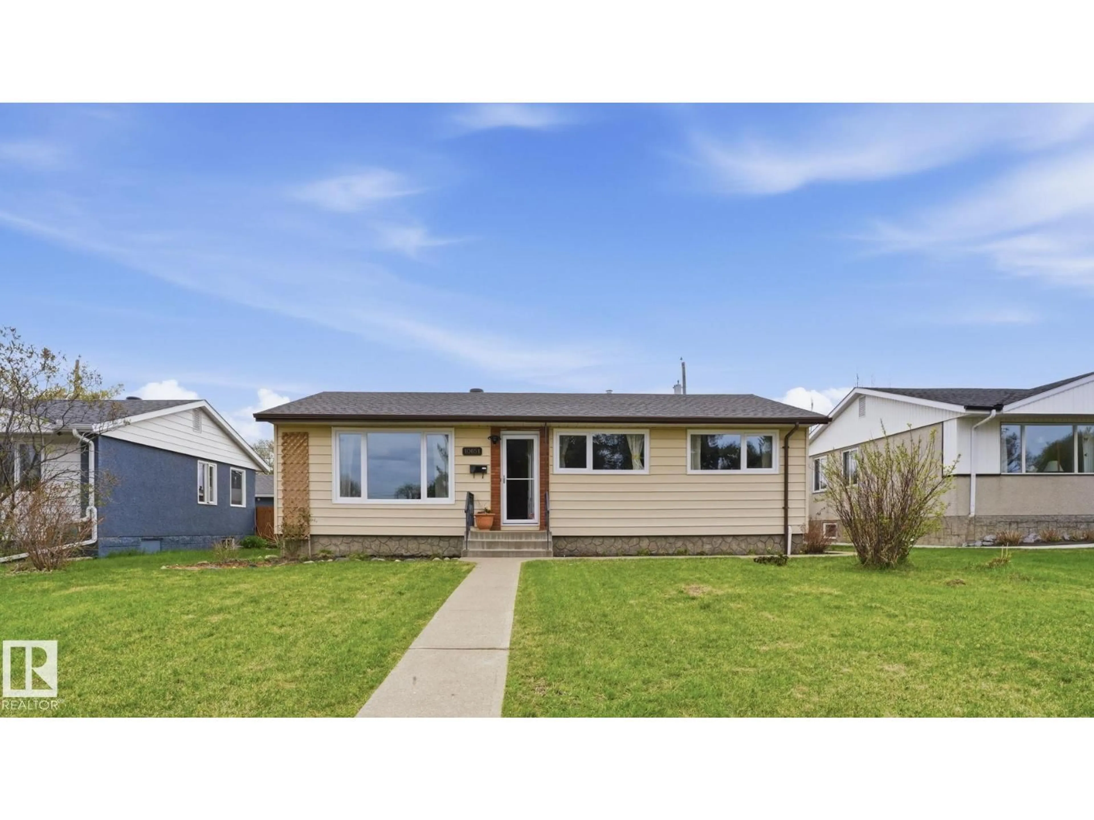 Home with vinyl exterior material, street for NW - 10651 61 ST, Edmonton Alberta T6A2L4