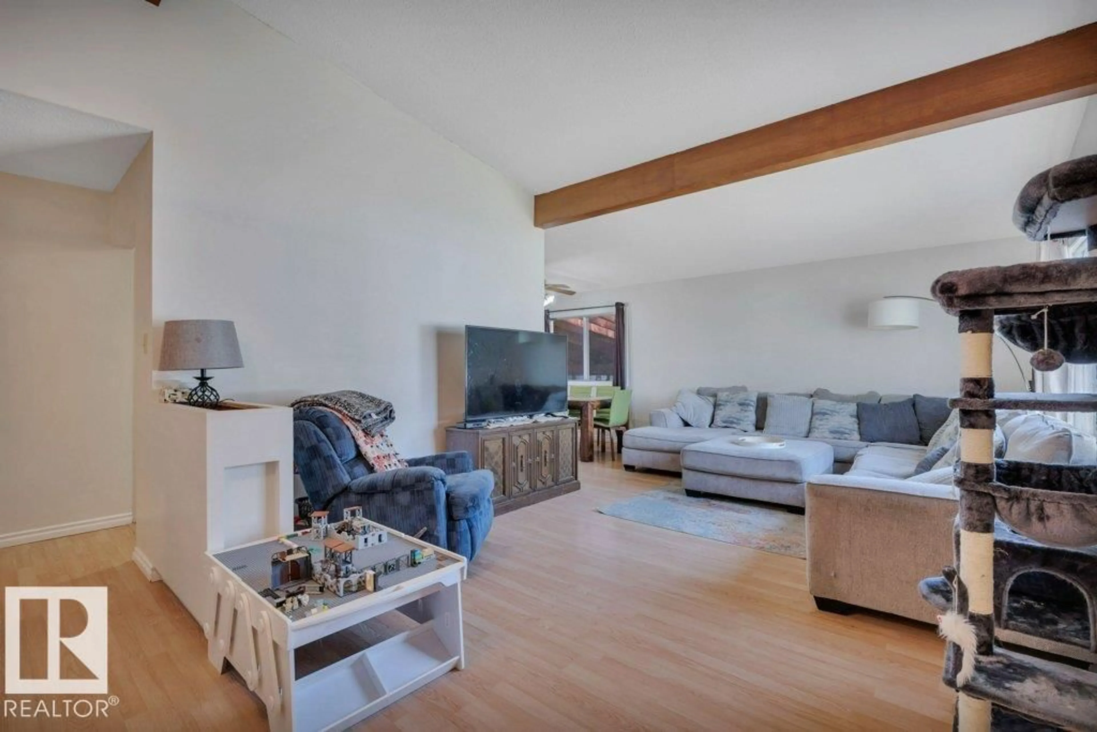 Living room with furniture, wood/laminate floor for 5411 44 AV, Wetaskiwin Alberta T9A0C6