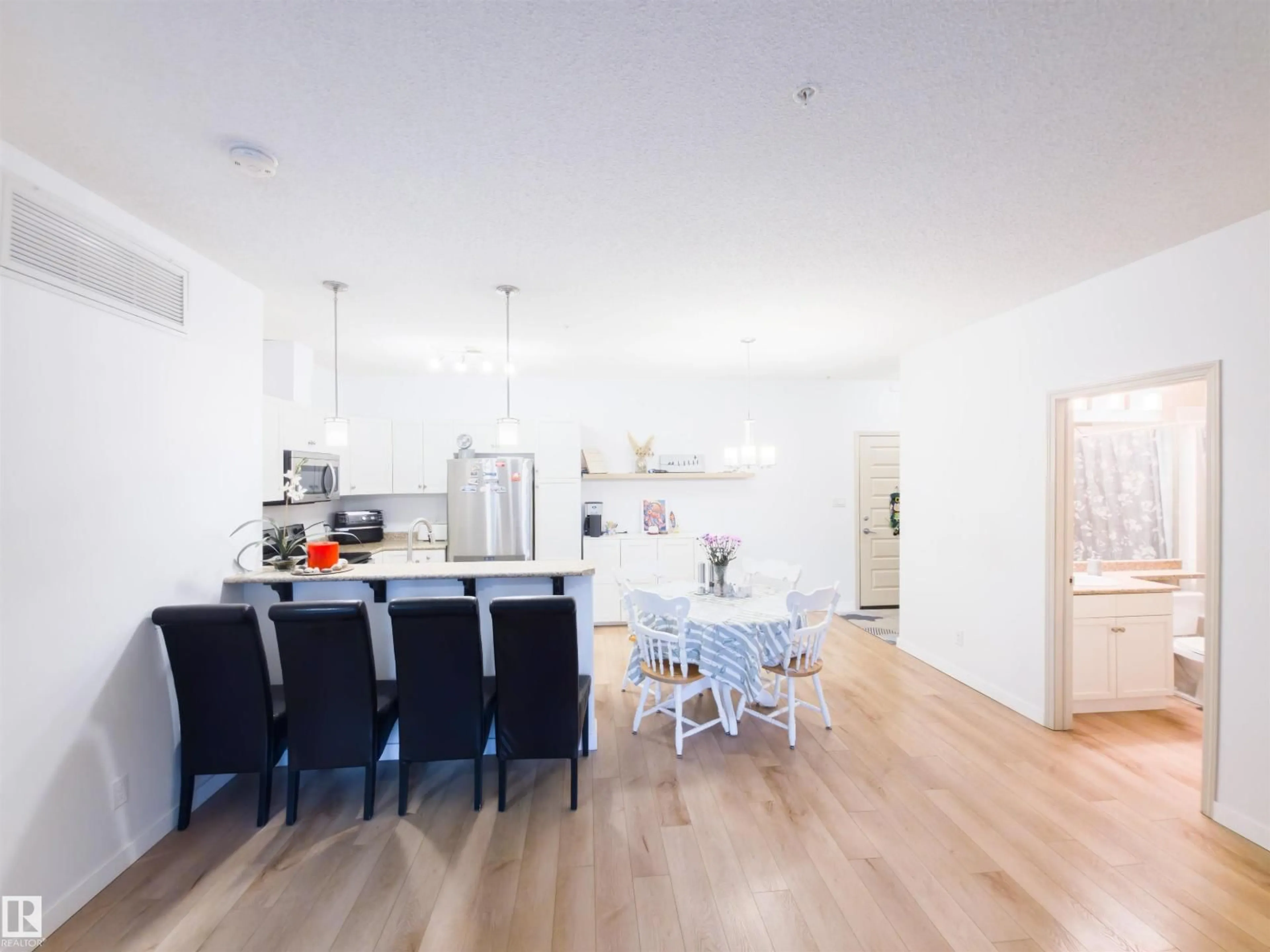 Open concept kitchen, wood/laminate floor for 135 7825 71 ST NW, Edmonton Alberta T6B3R9