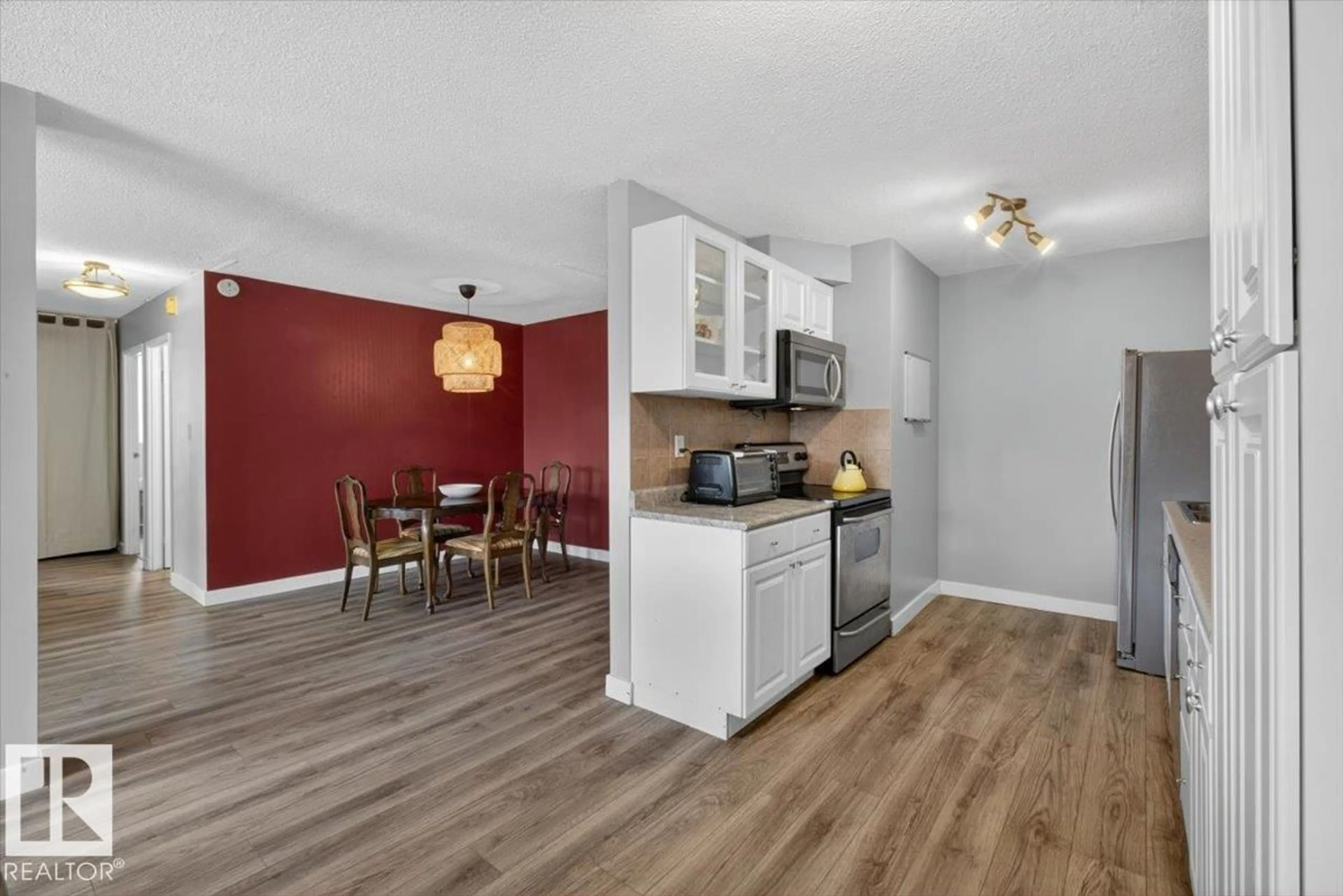 Open concept kitchen, wood/laminate floor for 405 10011 116 NW, Edmonton Alberta T5K1V4