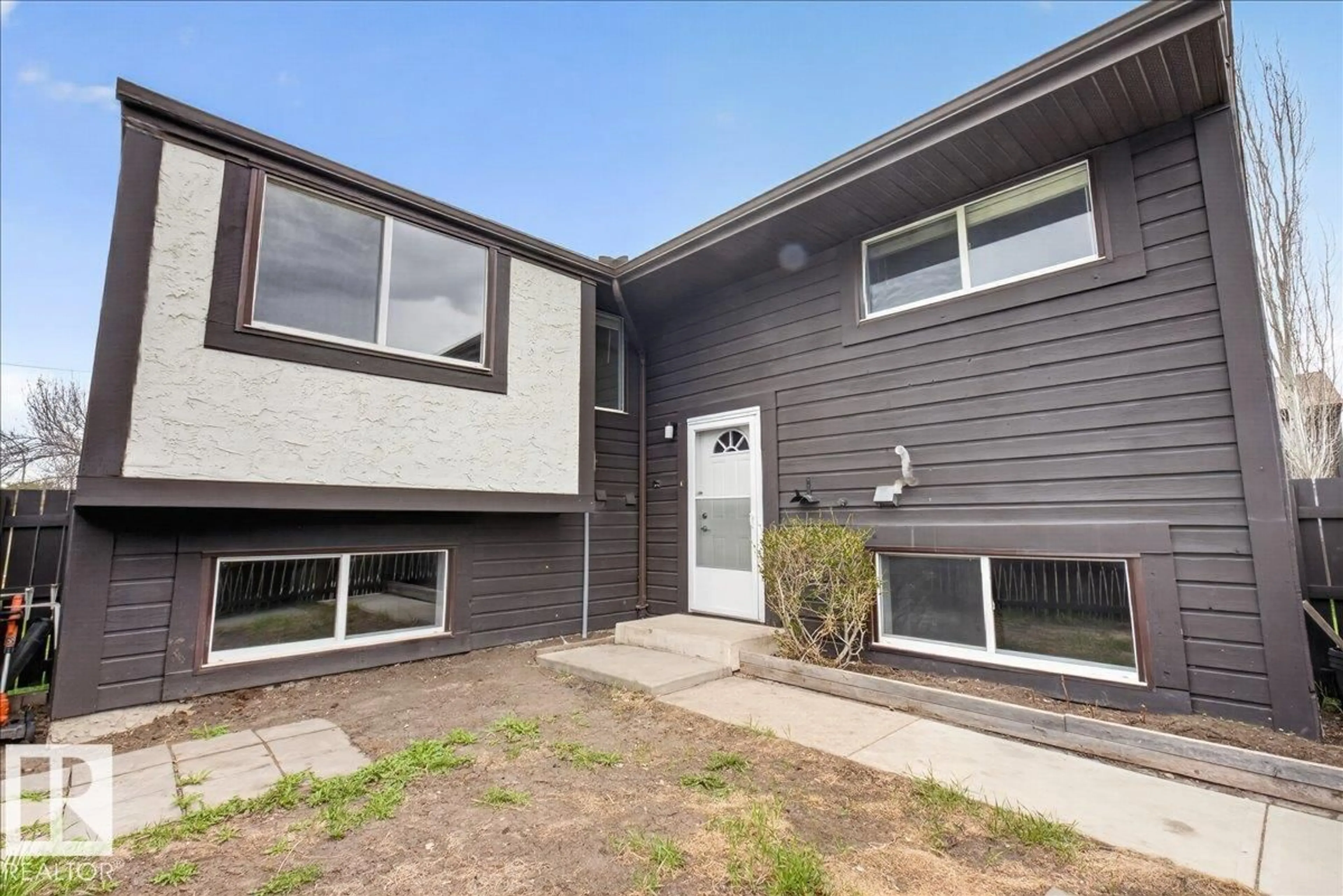 Home with vinyl exterior material, street for 1066 KNOTTWOOD RD, Edmonton Alberta T6K3R4