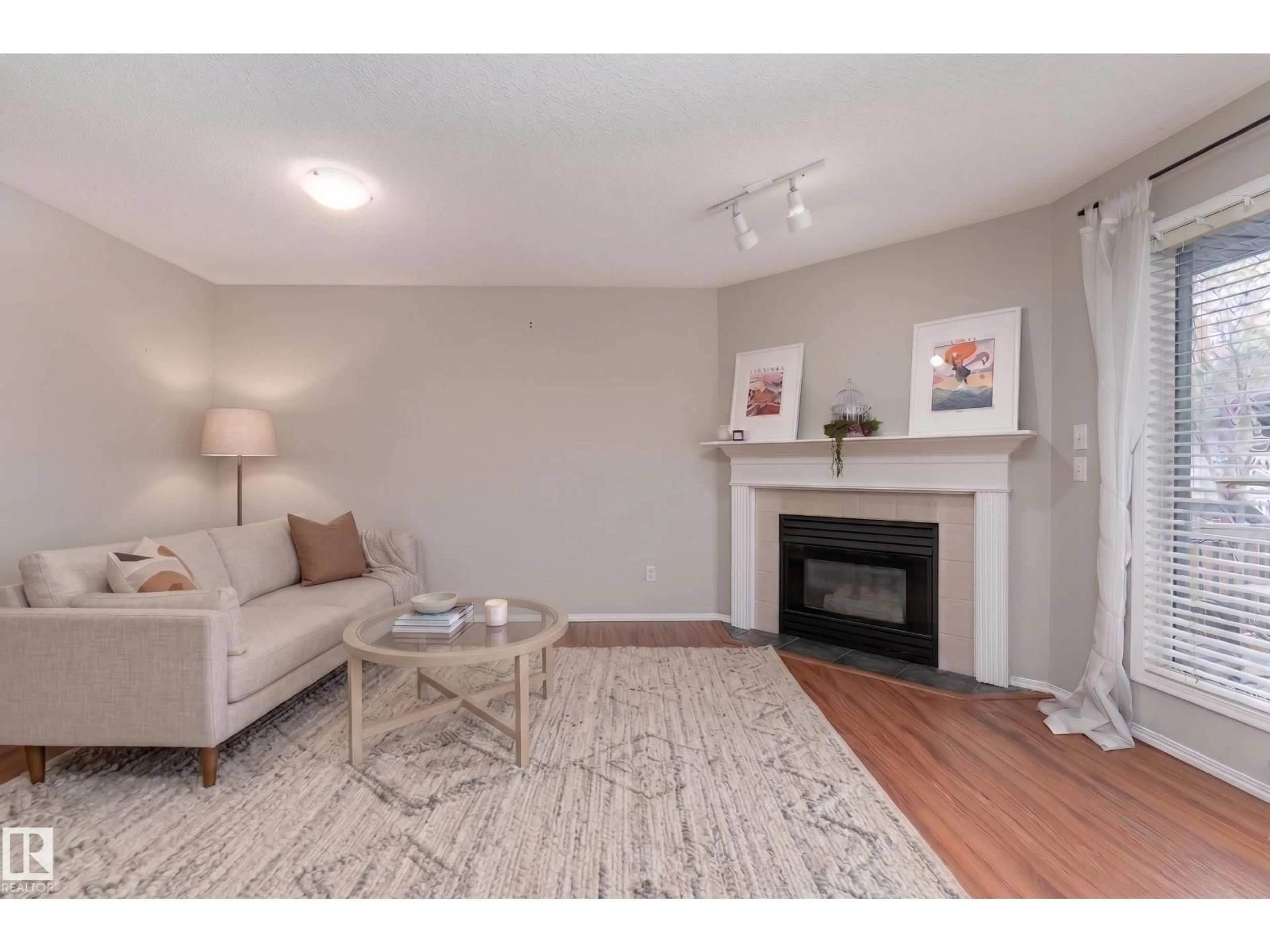 Living room with furniture, wood/laminate floor for 121 BULYEA RD, Edmonton Alberta T6R2M9