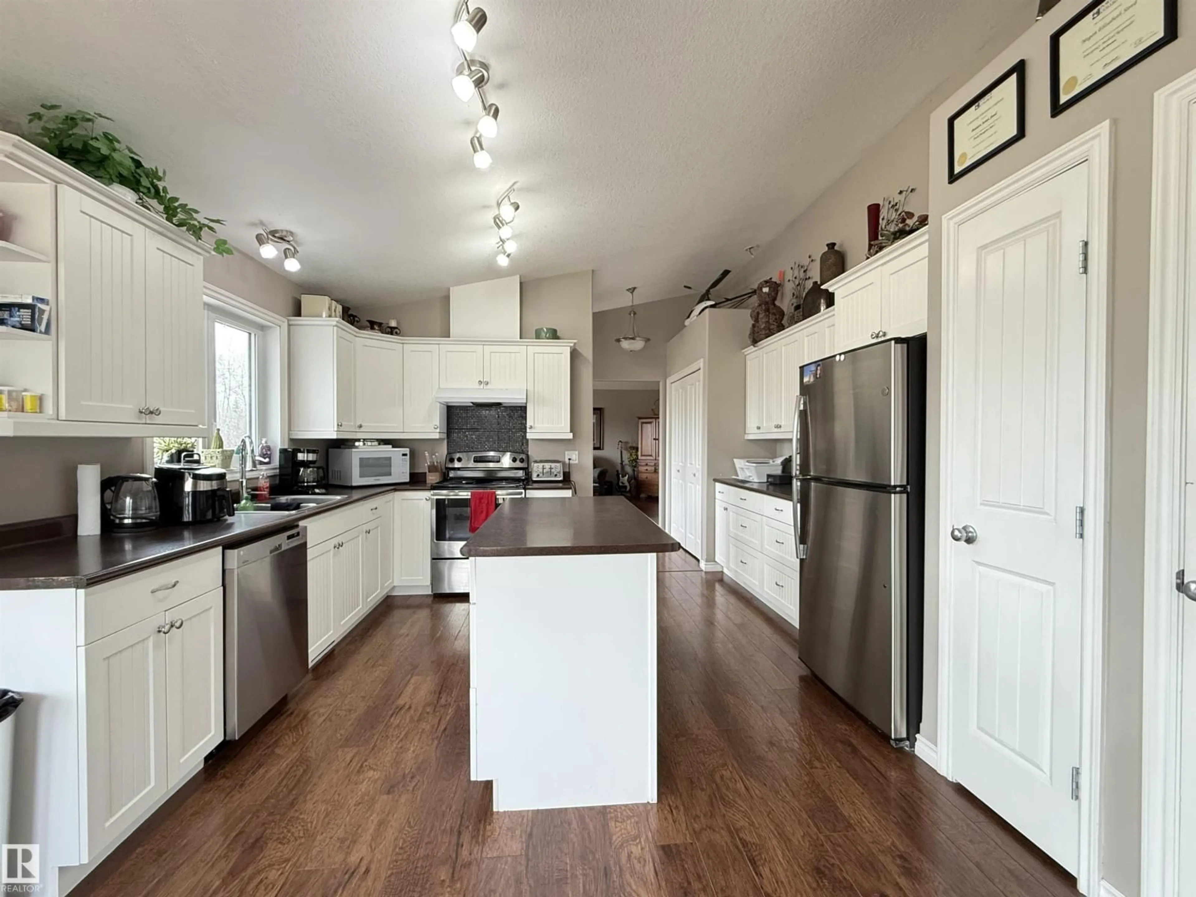 Open concept kitchen, wood/laminate floor for 15113 TOWNSHIP ROAD 670, Rural Lac La Biche County Alberta T0A2C0