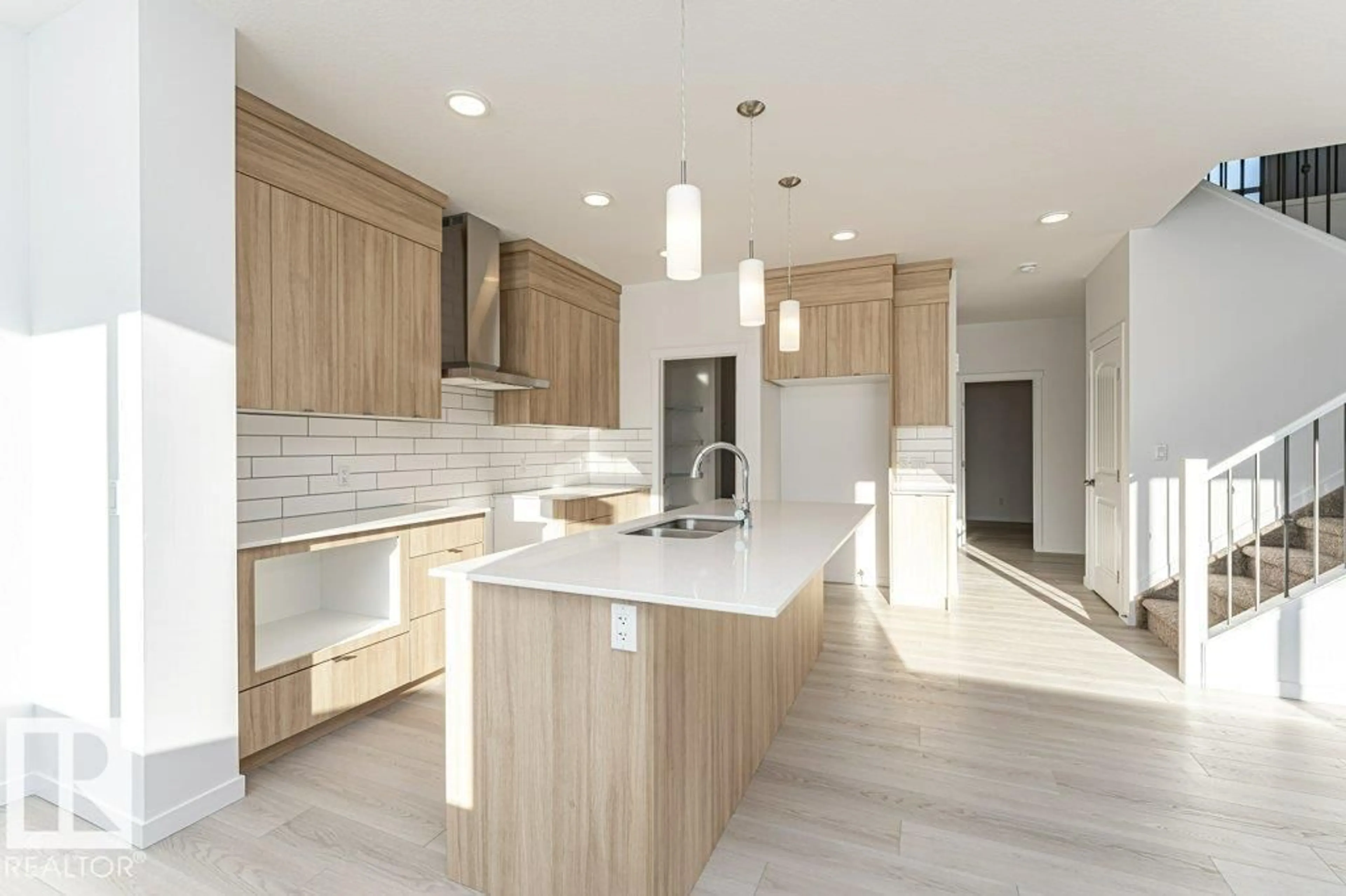 Open concept kitchen, wood/laminate floor for 2312 160 ST, Edmonton Alberta T6W5X2