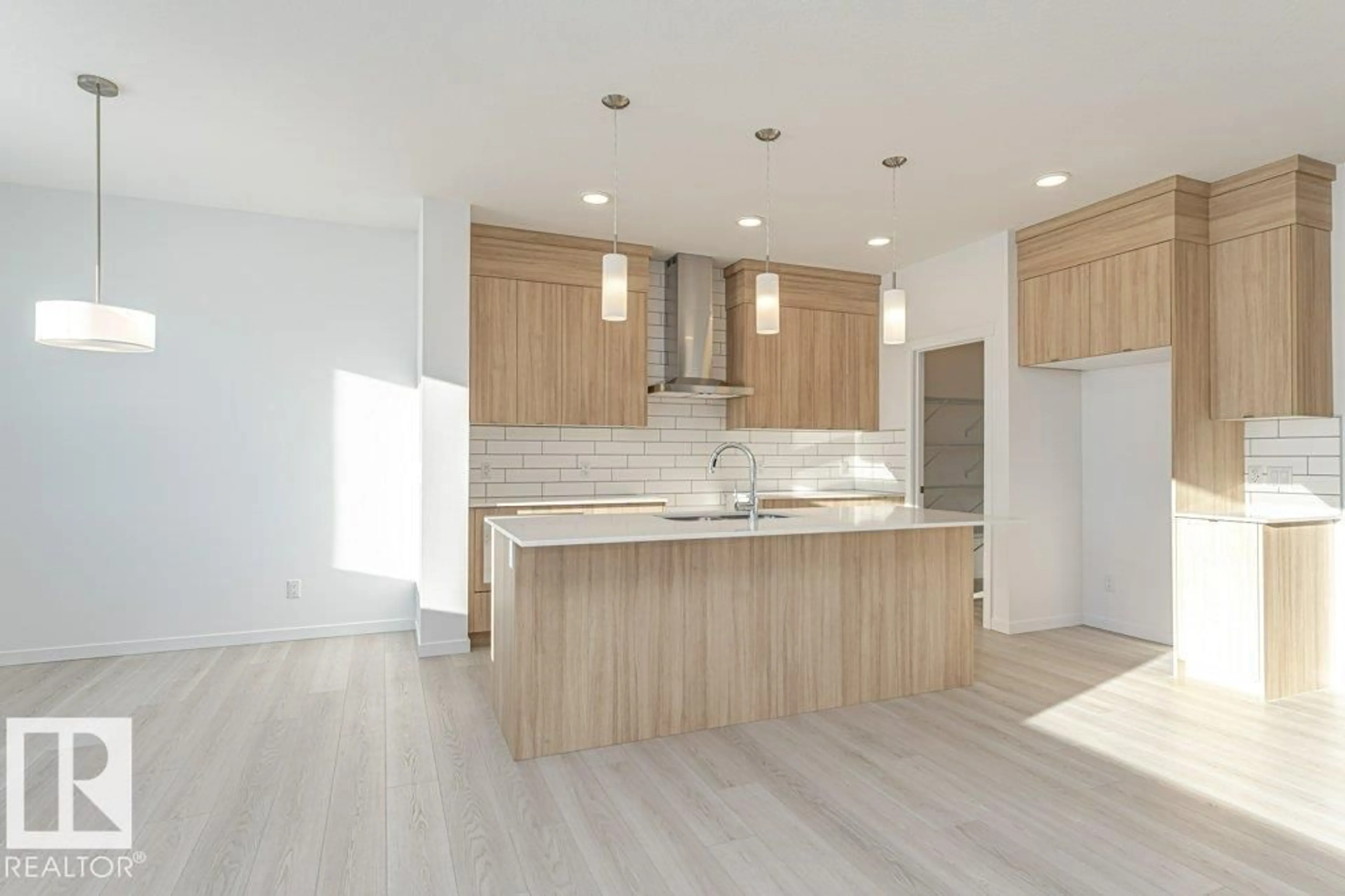 Open concept kitchen, wood/laminate floor for 2312 160 ST, Edmonton Alberta T6W5X2
