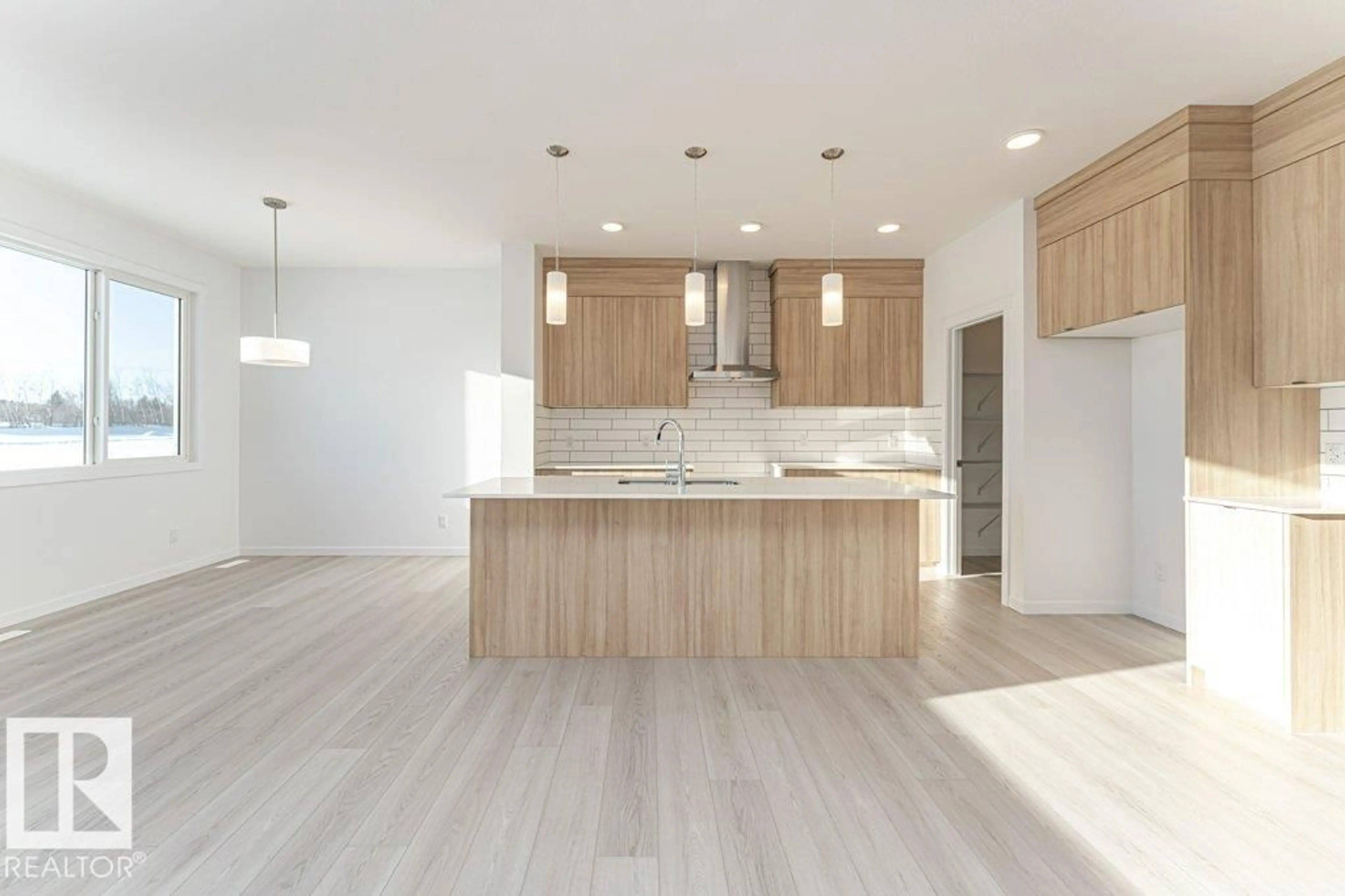 Open concept kitchen, wood/laminate floor for 2312 160 ST, Edmonton Alberta T6W5X2
