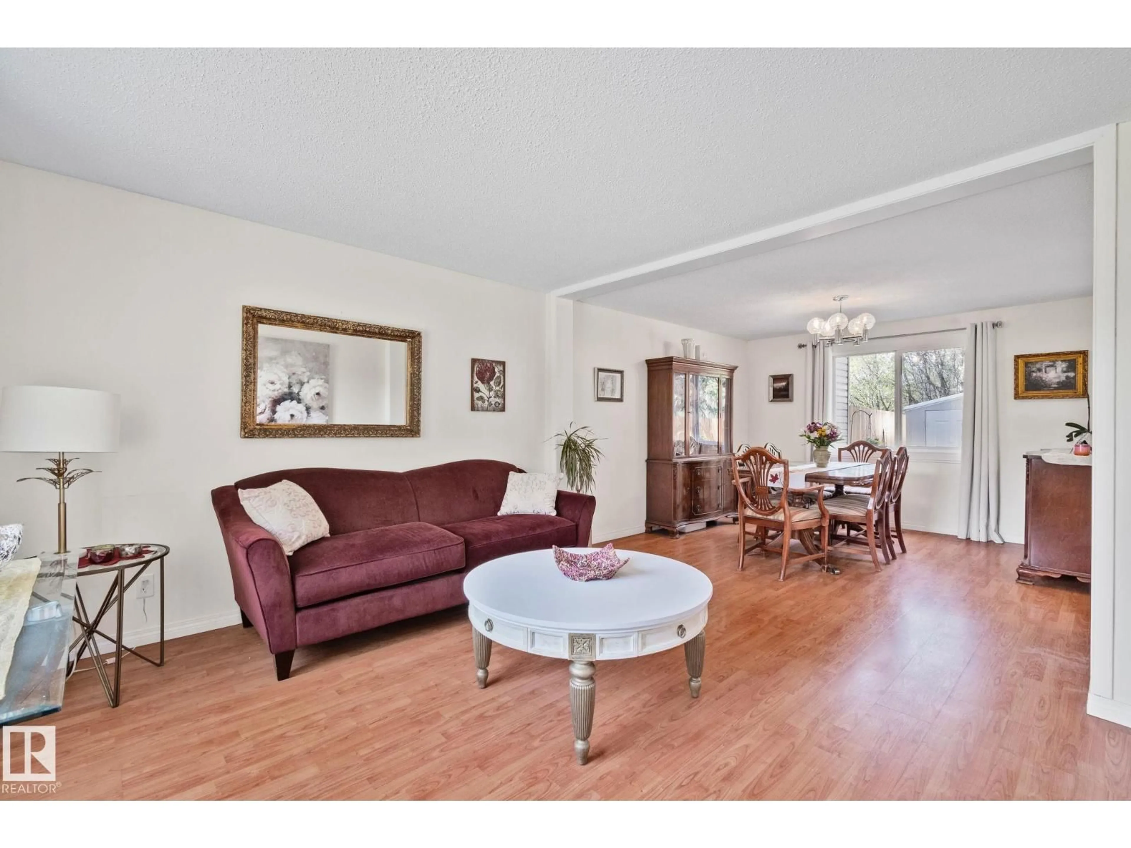 Living room with furniture, wood/laminate floor for 97 RIDGEWOOD, St. Albert Alberta T8A0E9