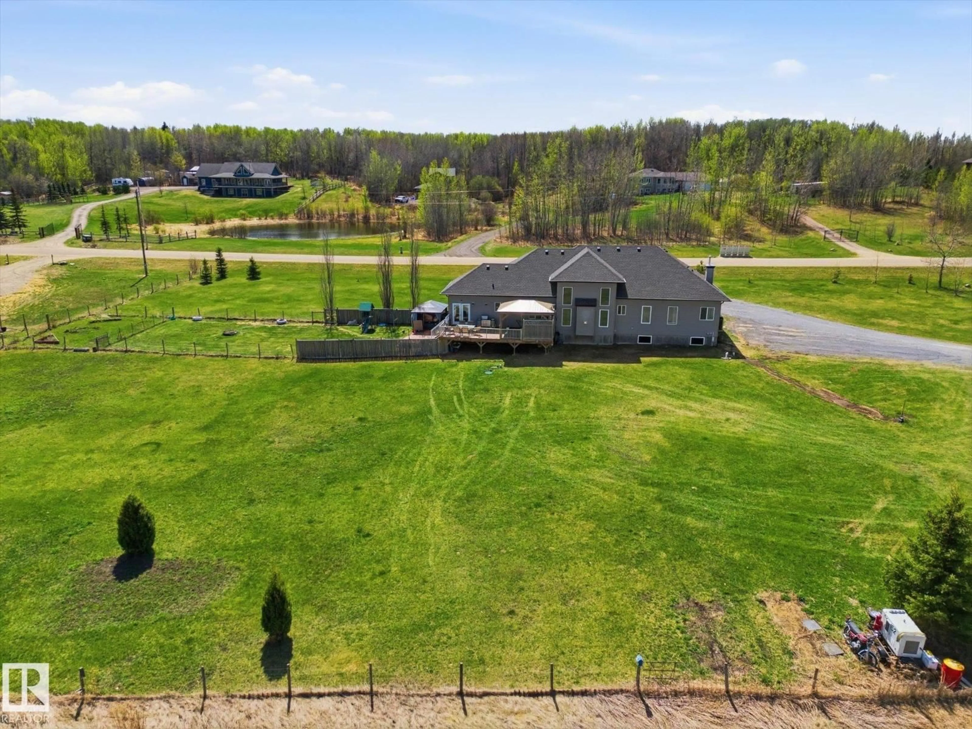 A pic from outside/outdoor area/front of a property/back of a property/a pic from drone, water/lake/river/ocean view for 101 - 54419 RGE ROAD 14, Rural Lac Ste. Anne County Alberta T0E1V0