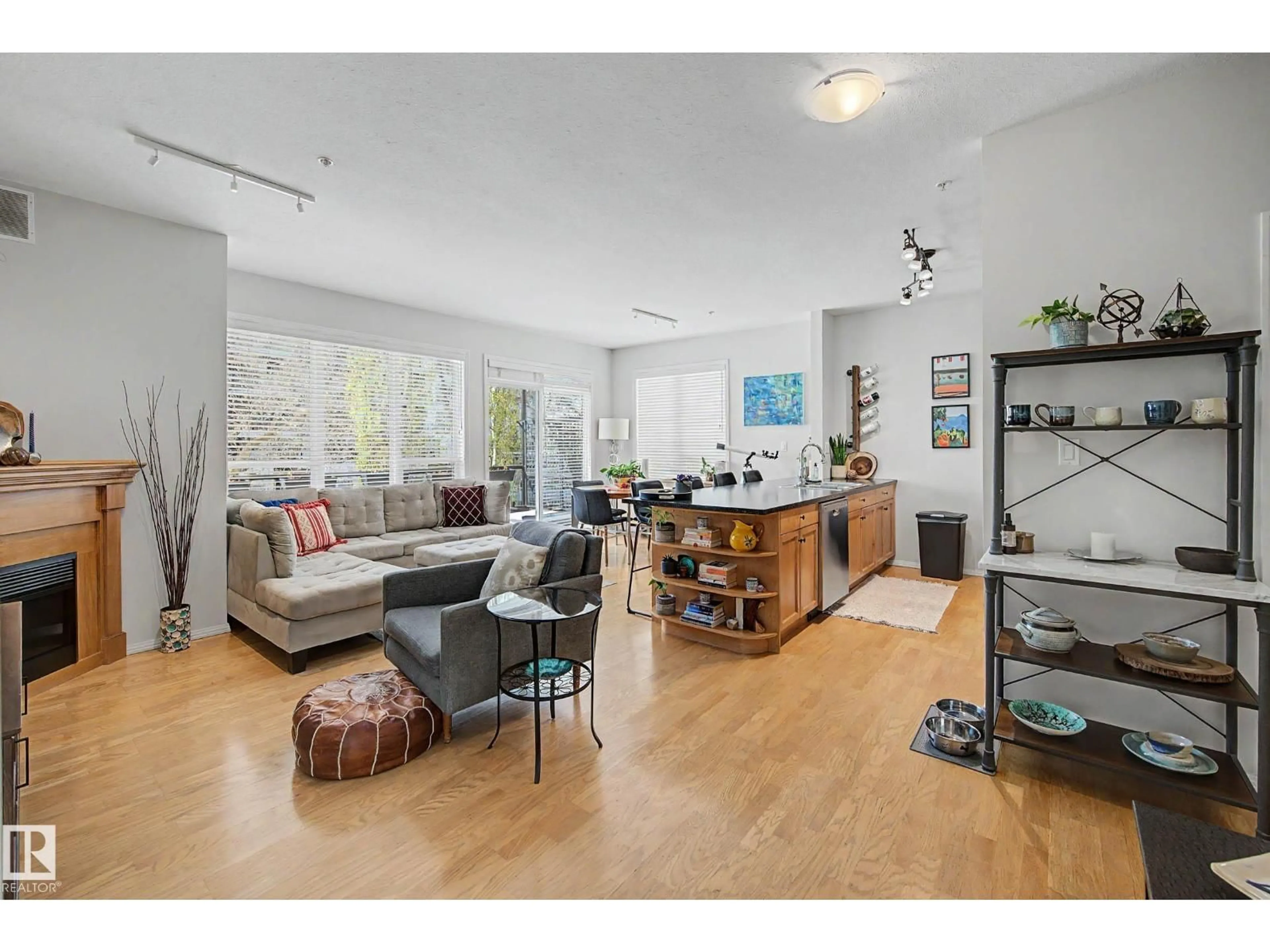 Living room with furniture, wood/laminate floor for 10023 NW - 334 110 ST, Edmonton Alberta T5K1J5