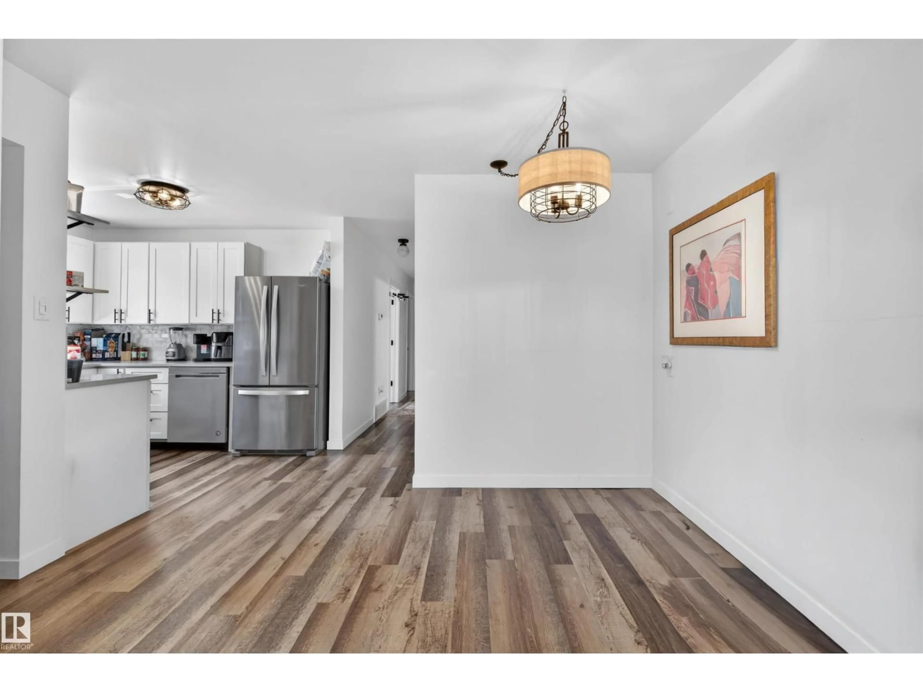 Open concept kitchen, wood/laminate floor for NW - 12028-30 88 ST, Edmonton Alberta T5B3S4