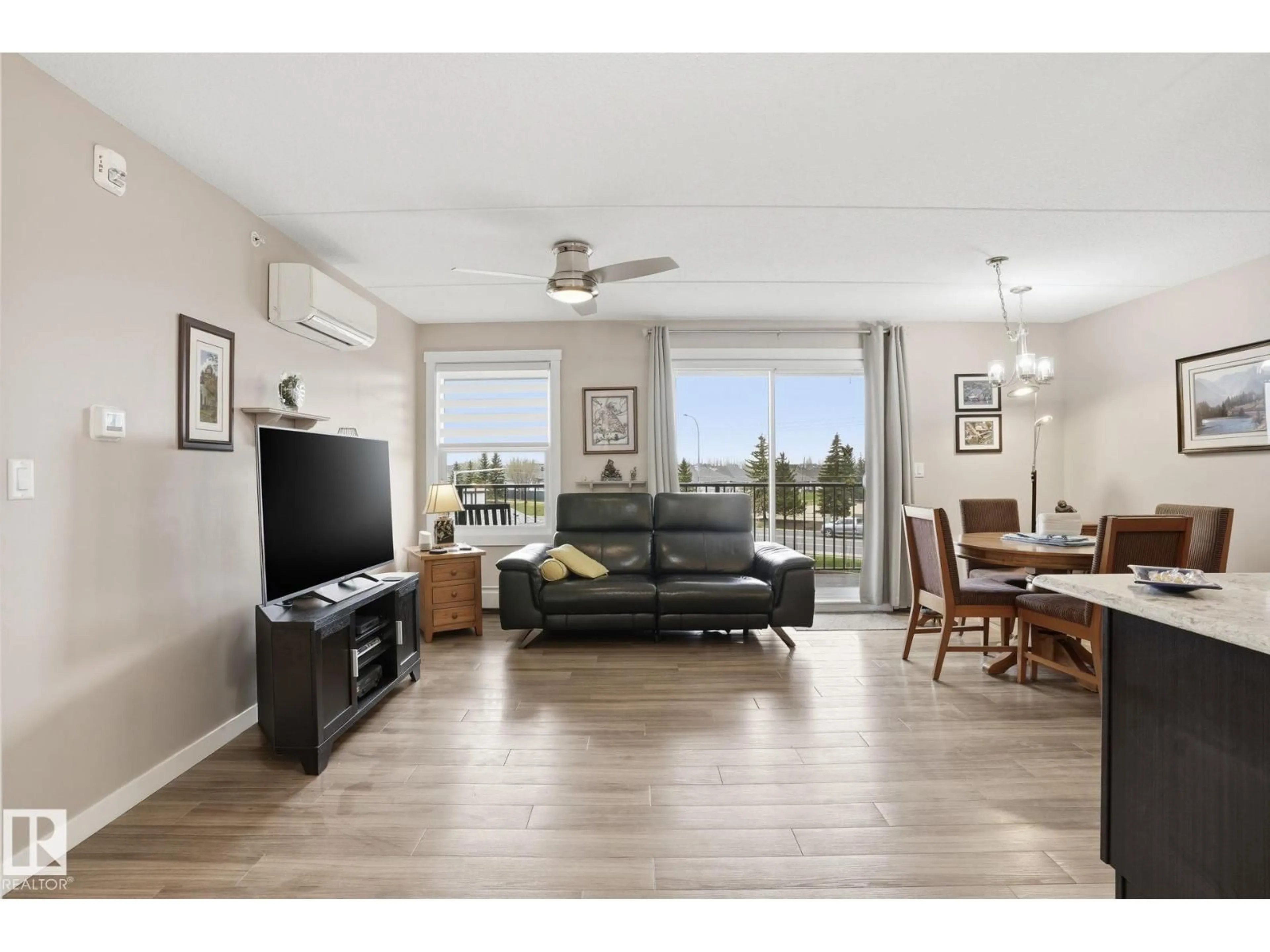 Living room with furniture, wood/laminate floor for #302 - 4103 50 ST, Beaumont Alberta T4X2C7