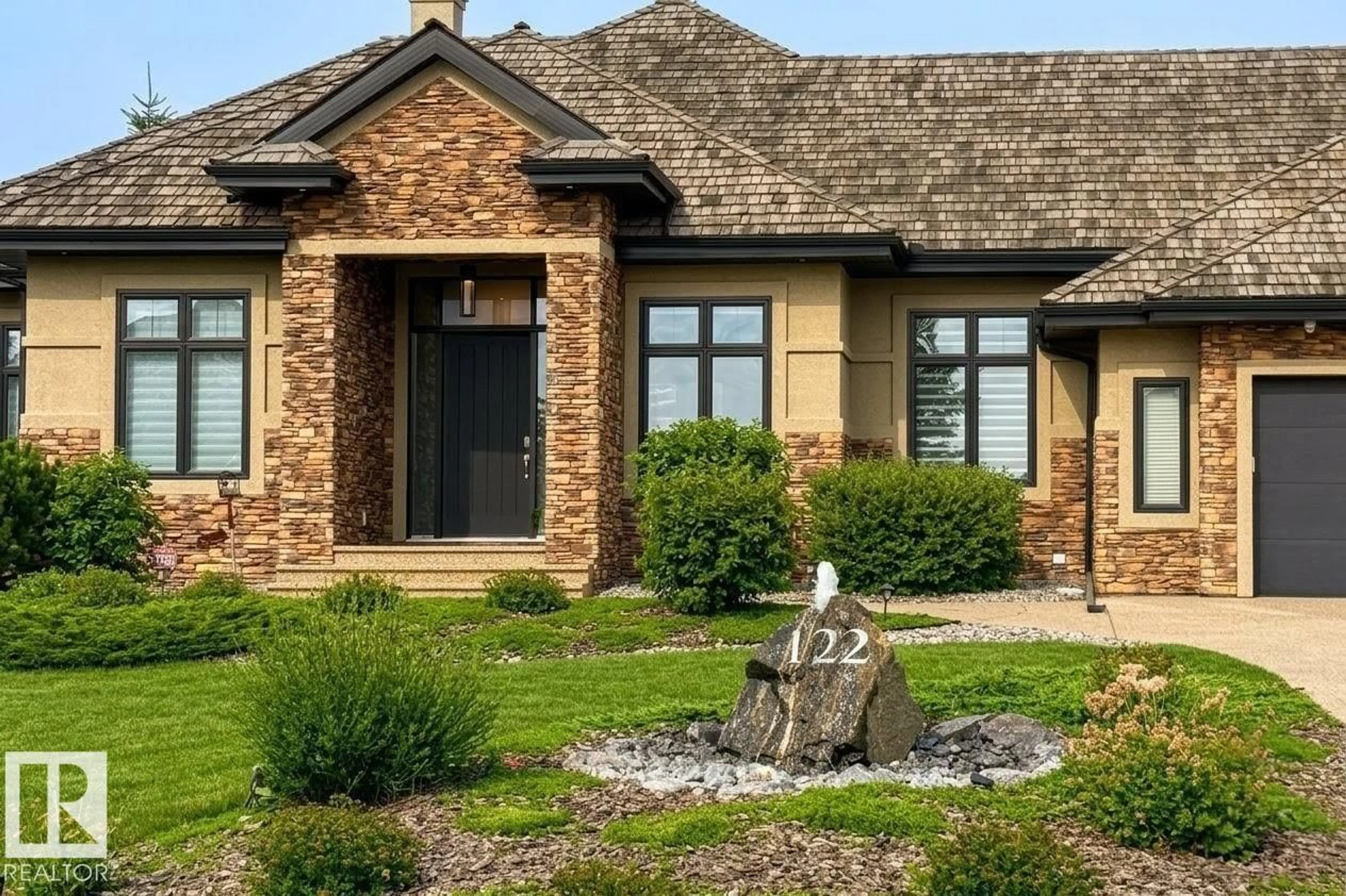 Home with brick exterior material, street for 122 RIVERSTONE DRIVE, Rural Sturgeon County Alberta T8T0B9