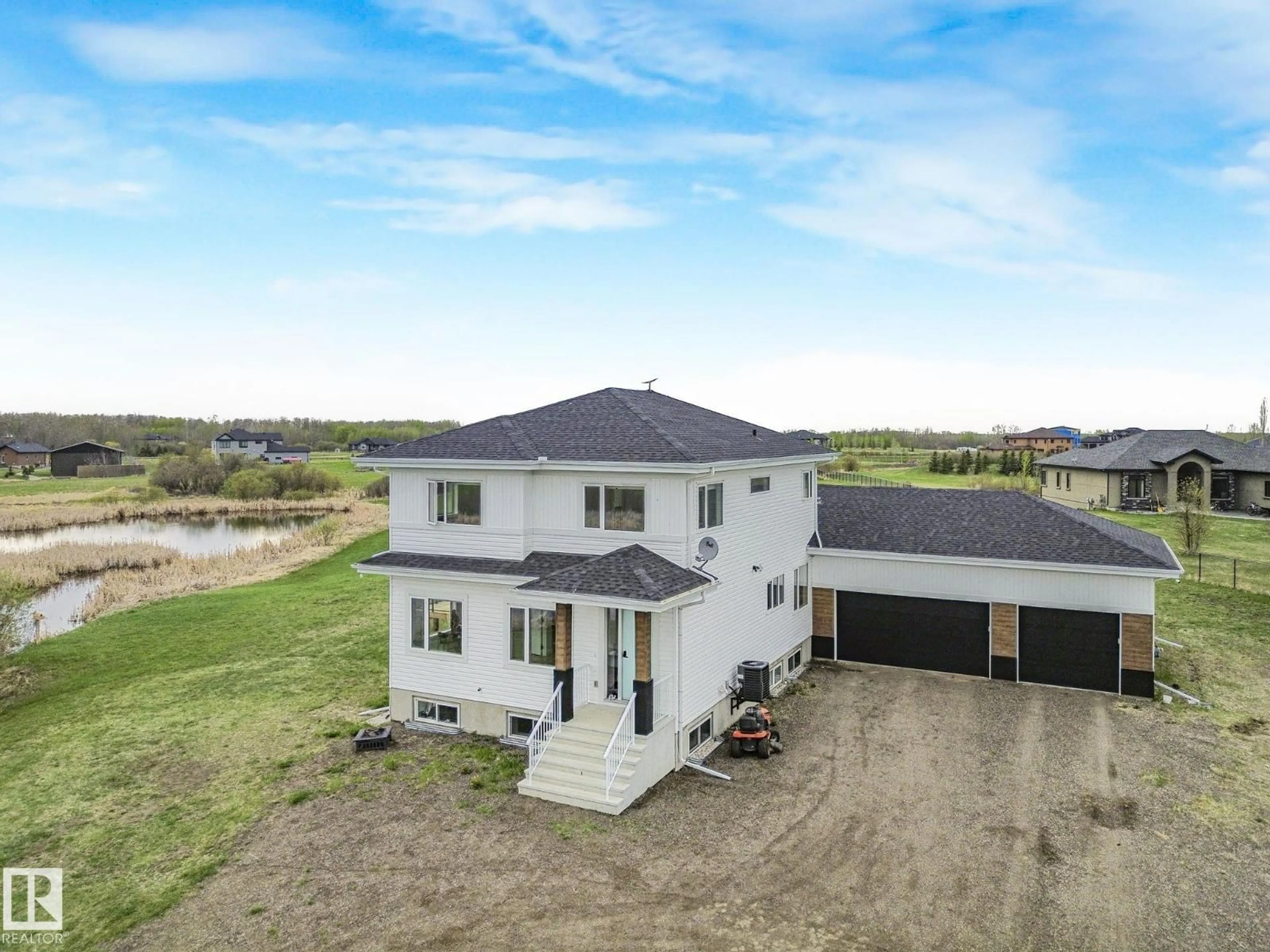 A pic from outside/outdoor area/front of a property/back of a property/a pic from drone, building for 60 23412 TWP RD 505, Rural Leduc County Alberta T4X0S1