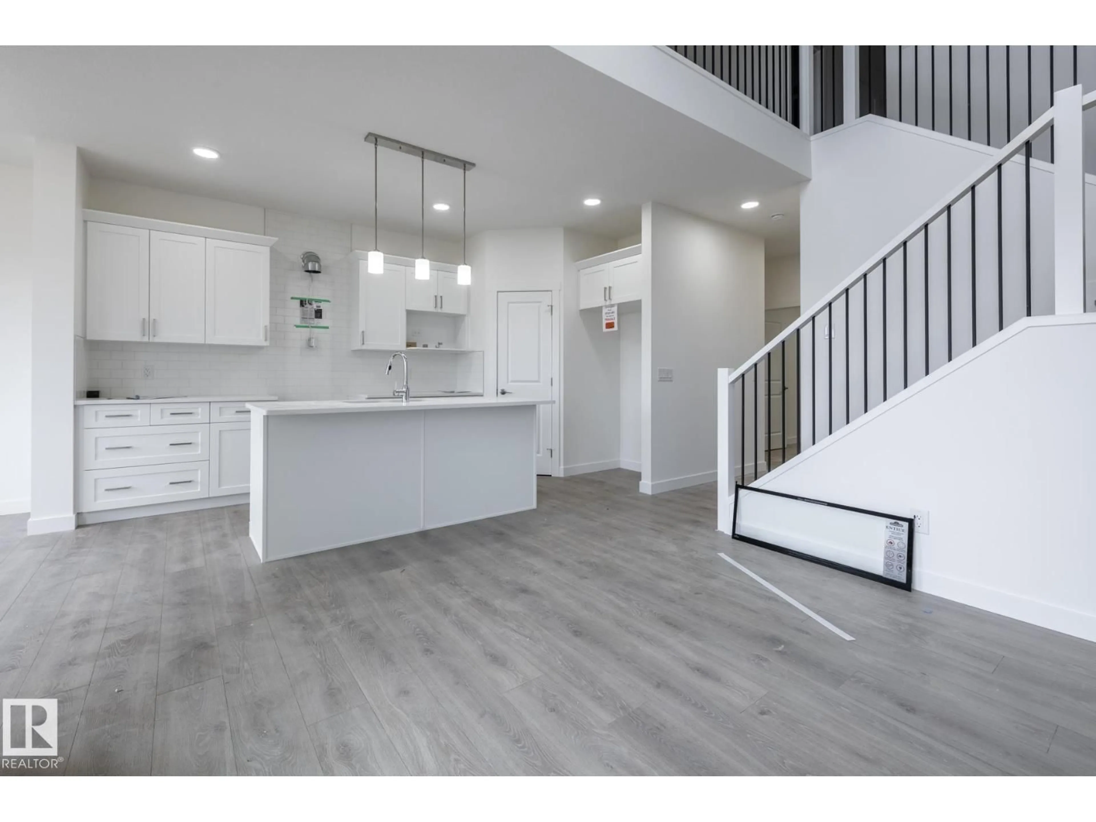 Open concept kitchen, wood/laminate floor for NE - 319 157 AV, Edmonton Alberta T5K6K8