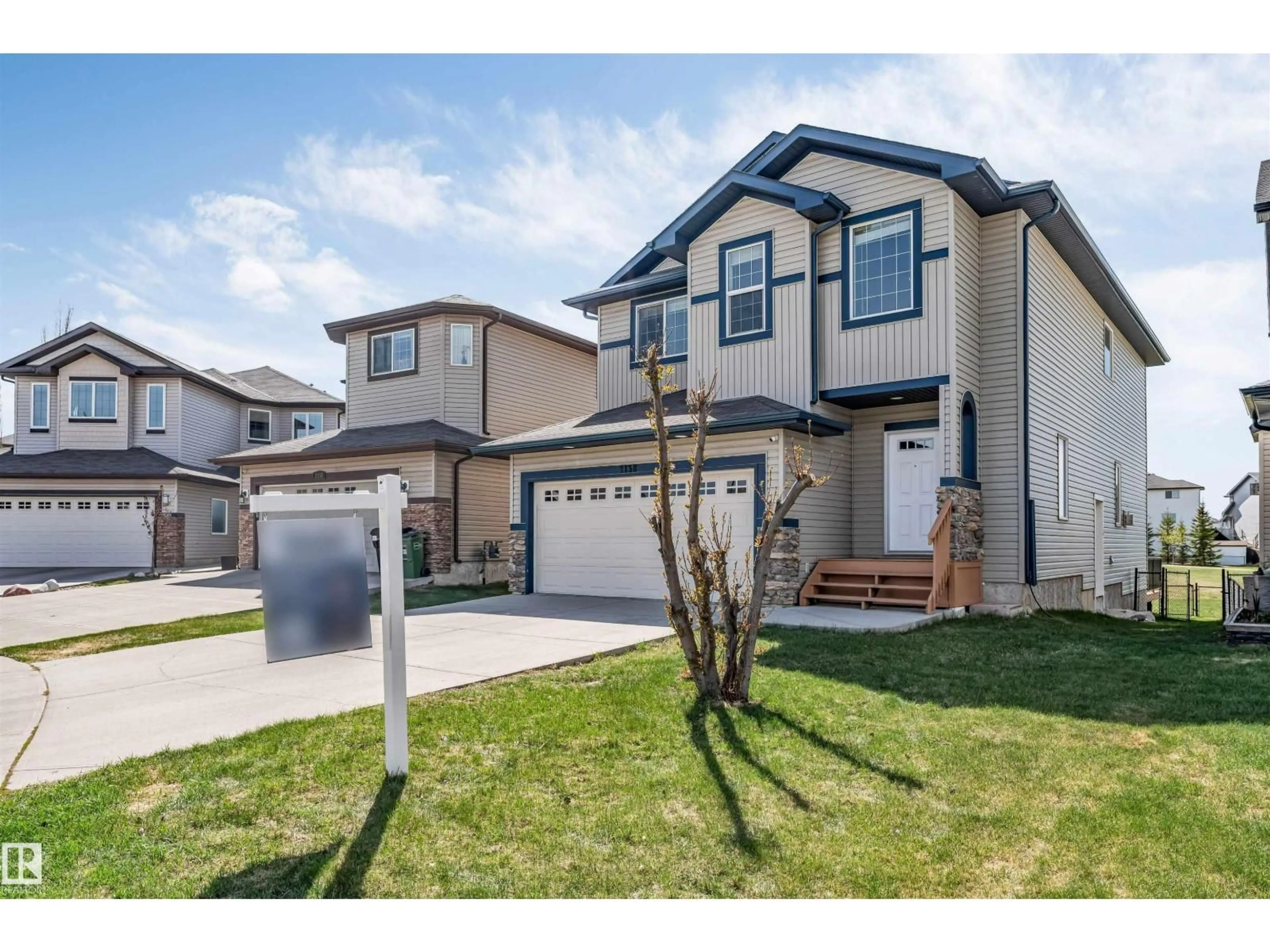Home with vinyl exterior material, street for NW - 2138 32B ST, Edmonton Alberta T6T0K5