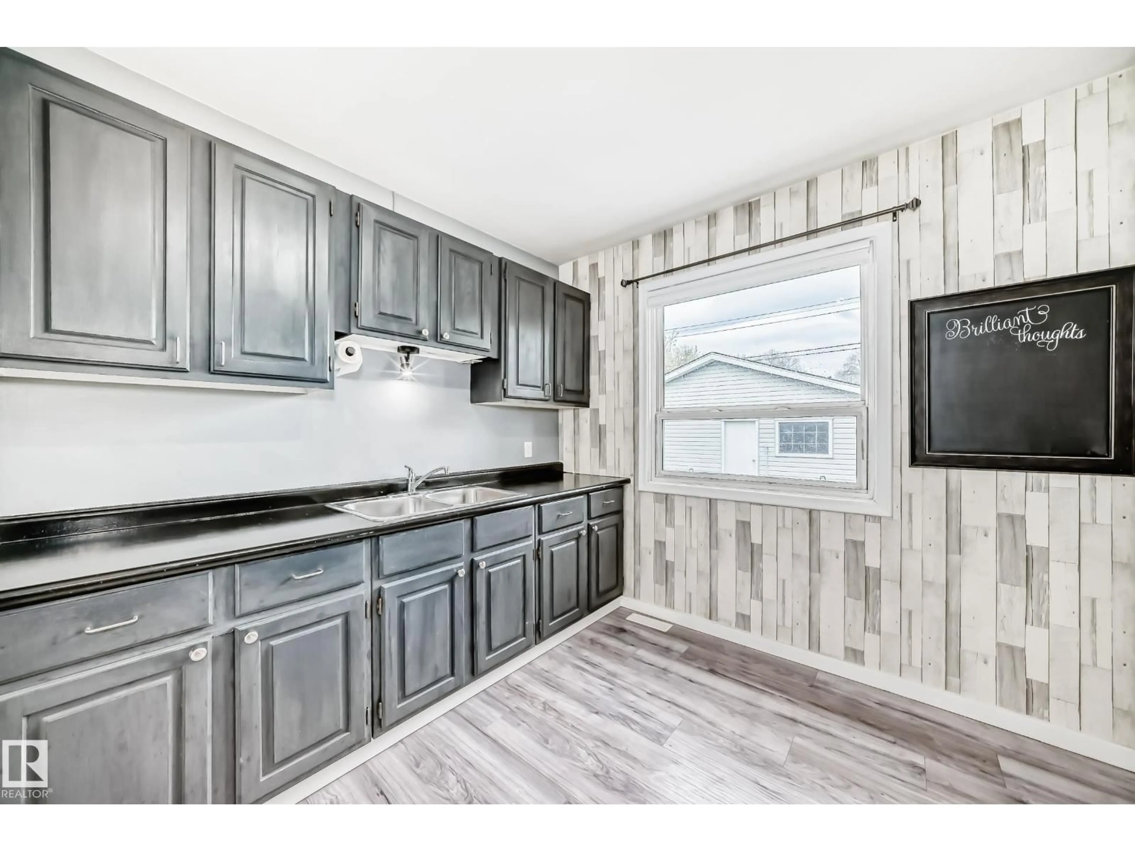 Open concept kitchen, wood/laminate floor for NW - 12030 48 ST, Edmonton Alberta T5W2Y8
