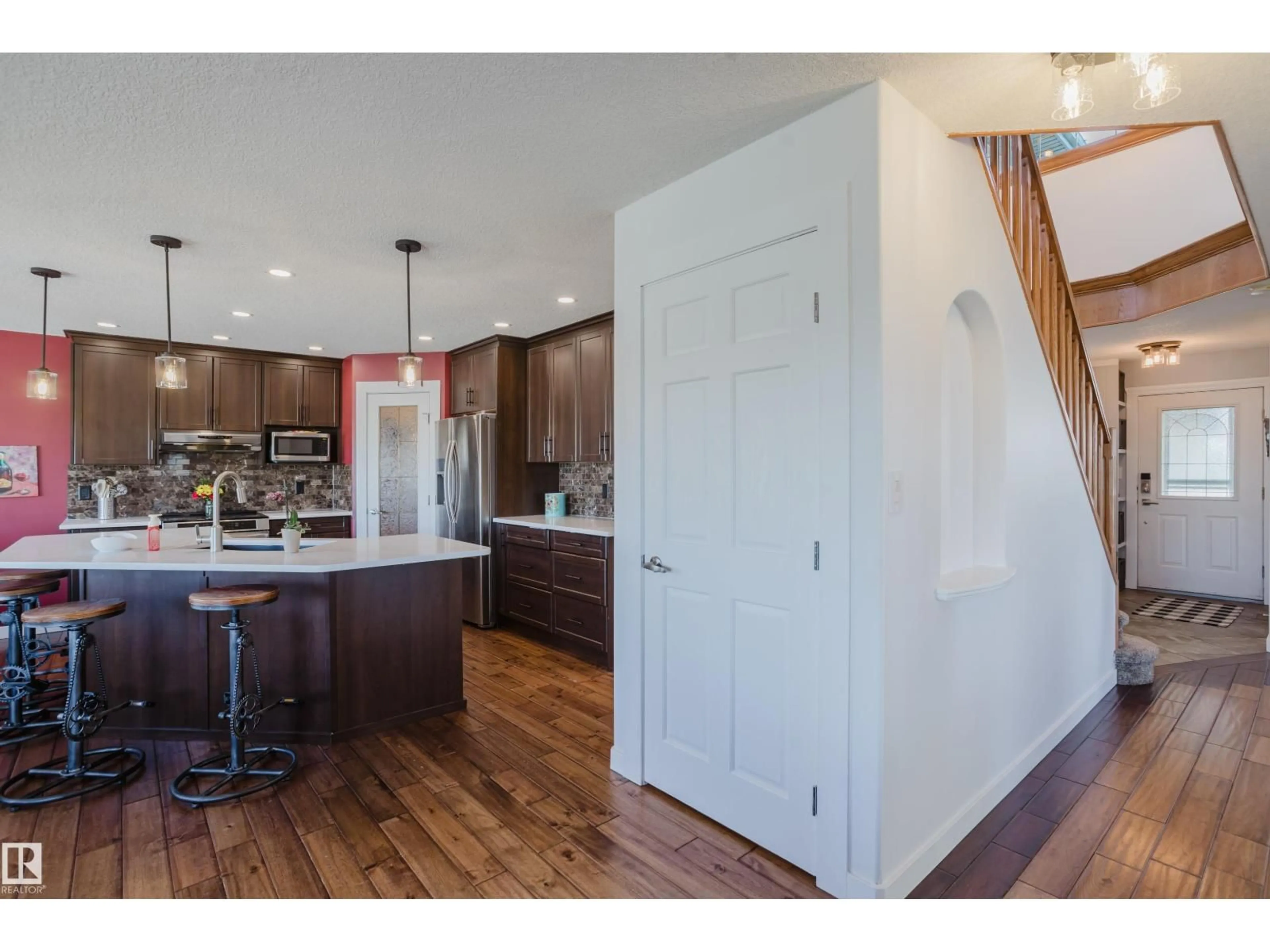 Open concept kitchen, wood/laminate floor for 16620 81 ST, Edmonton Alberta T5Z3J5