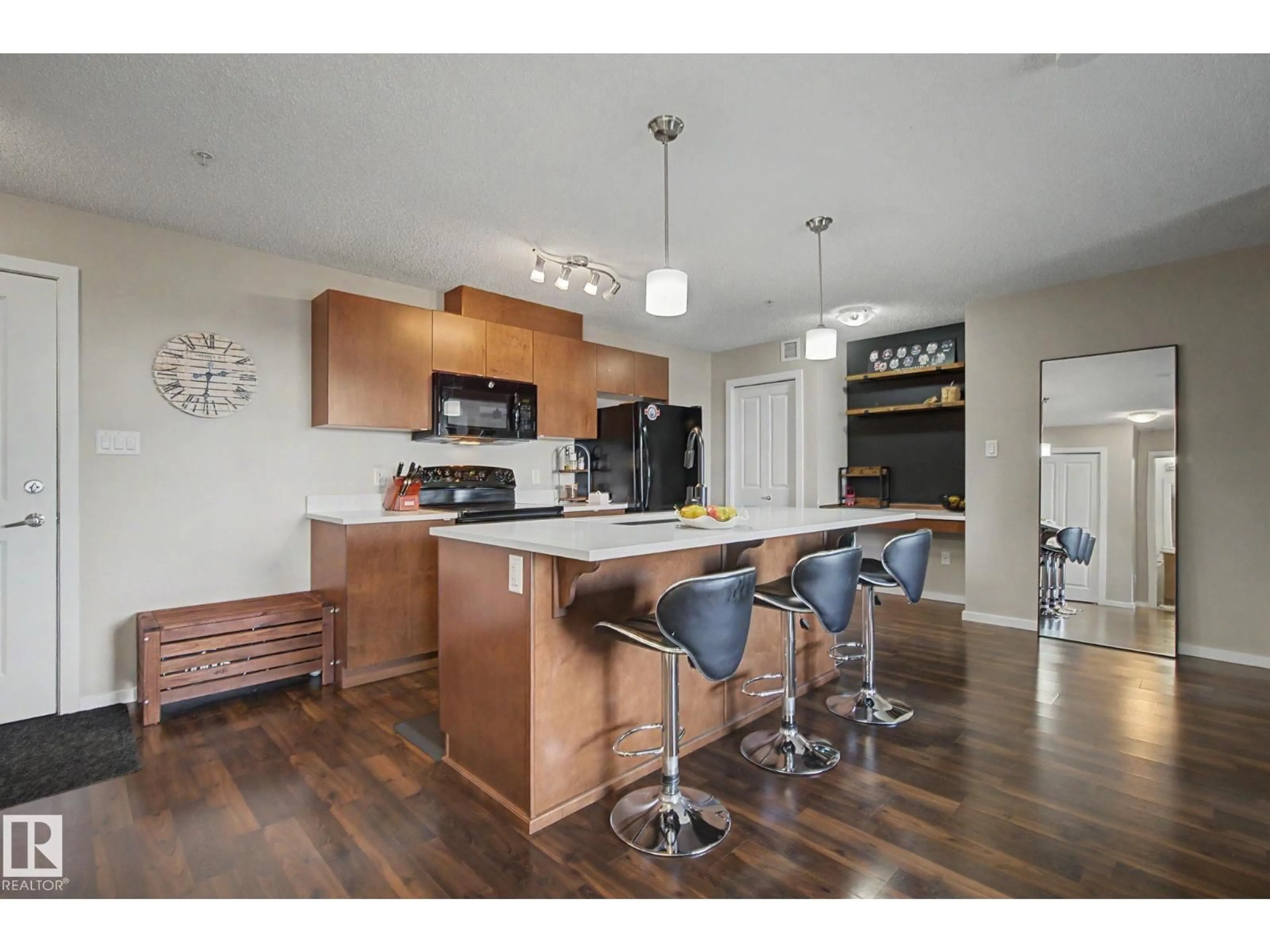 Open concept kitchen, wood/laminate floor for 504 - 334 ALBANY WY, Edmonton Alberta T6V0L2