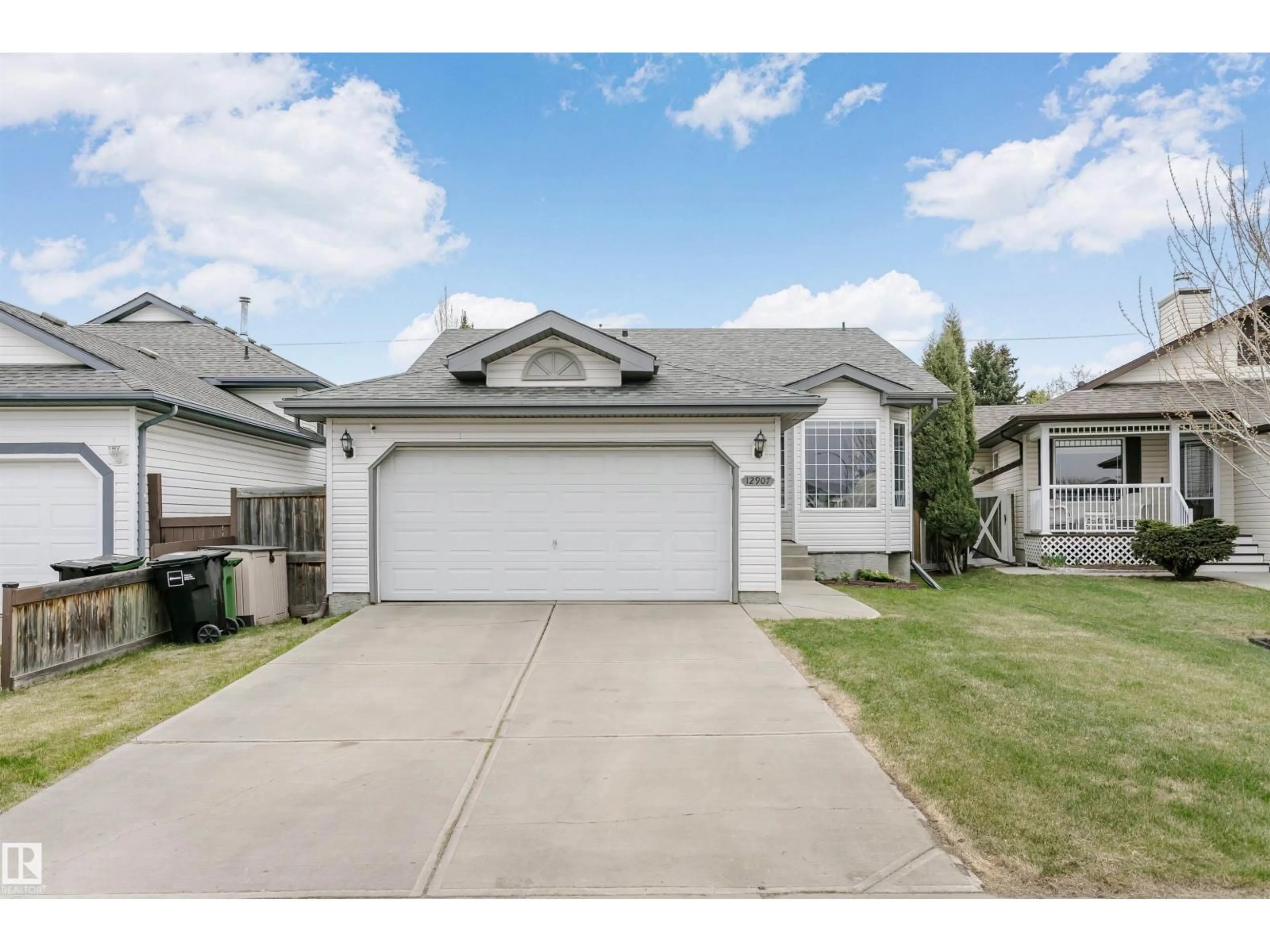 Home with vinyl exterior material, street for 12907 136 ST, Edmonton Alberta T5L5C8