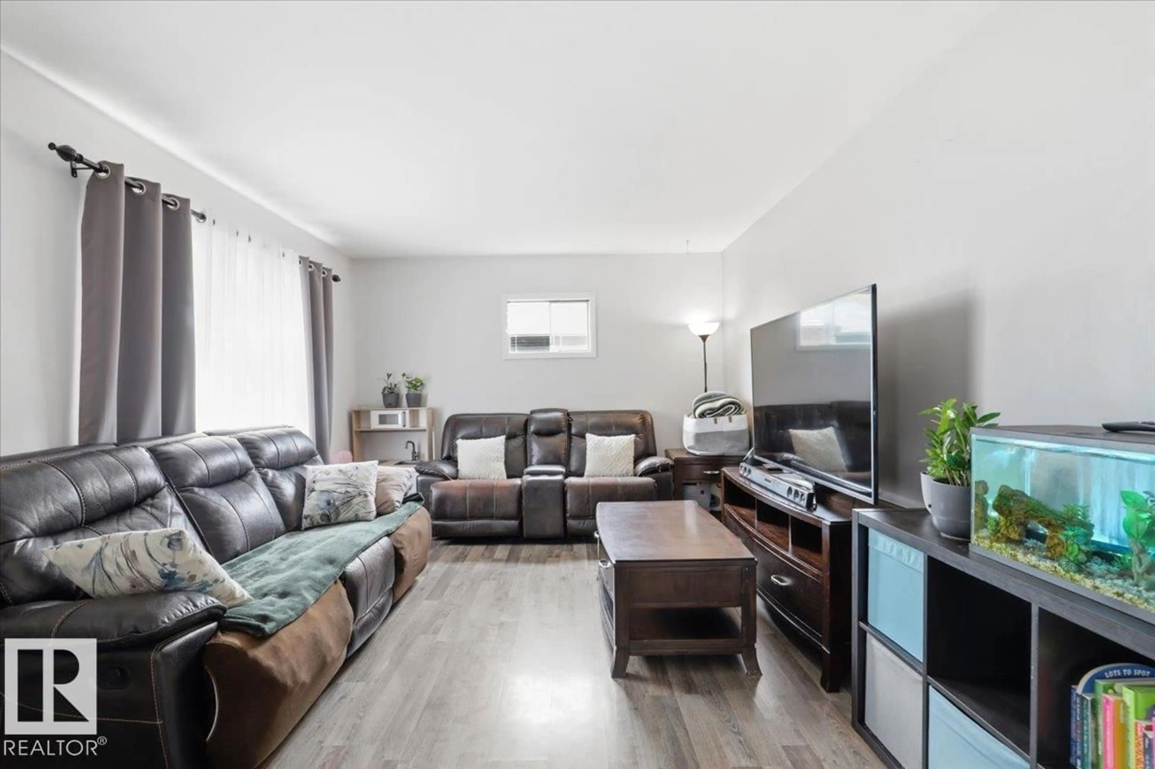Living room with furniture, wood/laminate floor for 4704 51 ST, Thorsby Alberta T0C2P0